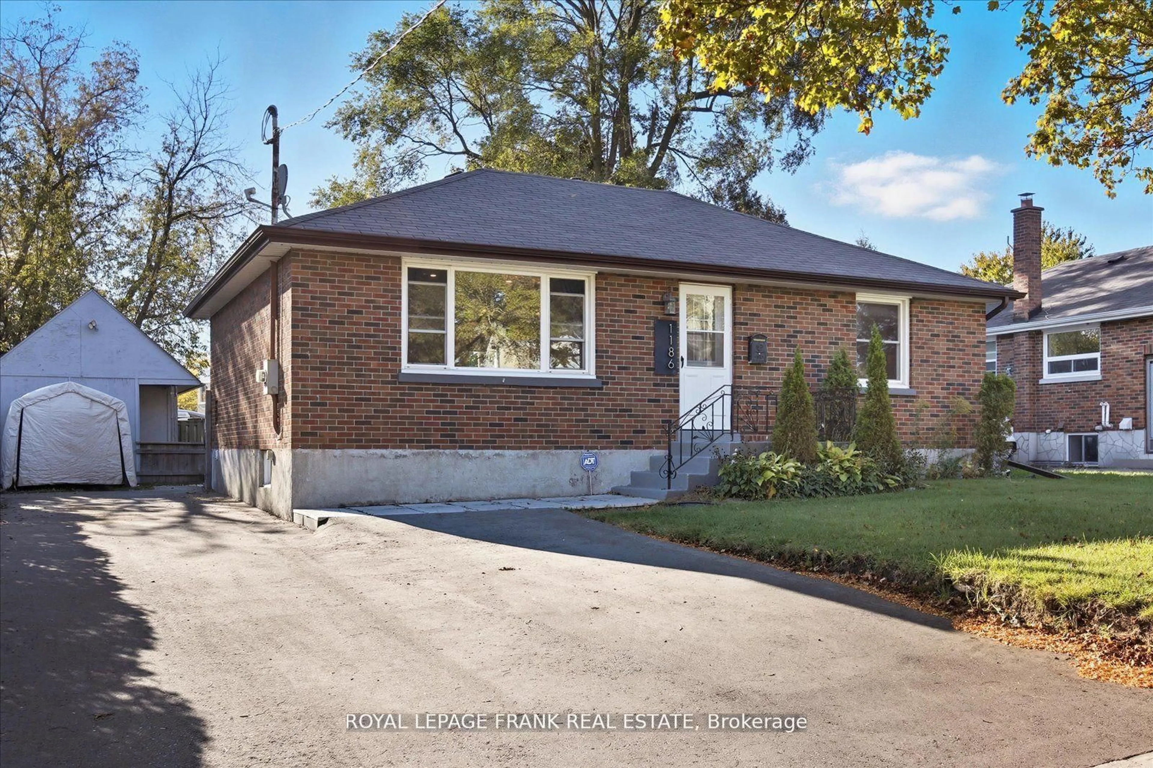Home with brick exterior material, street for 1186 Ravine Rd, Oshawa Ontario L1H 4E2