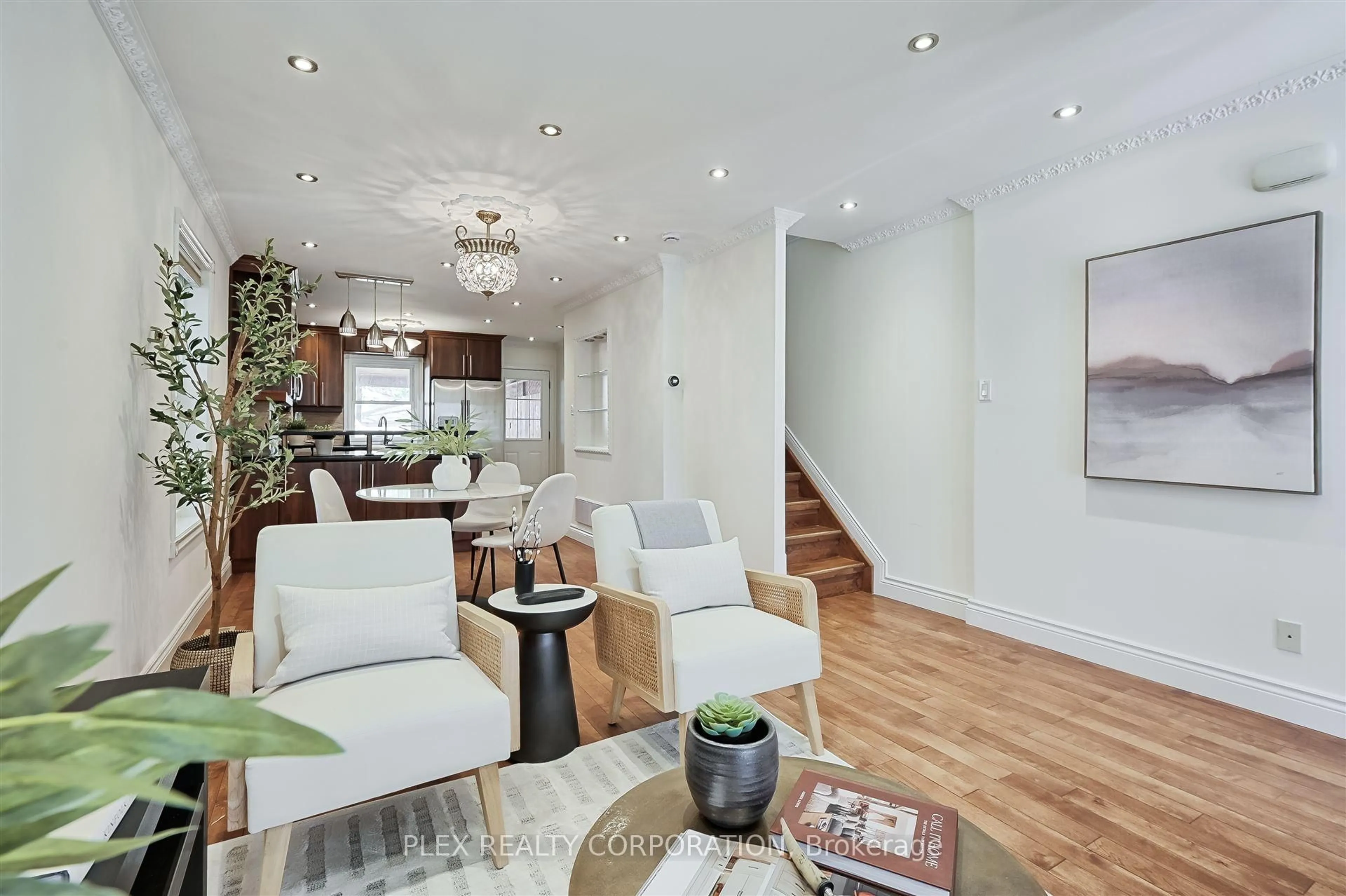 Living room with furniture, wood/laminate floor for 192 Coxwell Ave, Toronto Ontario M4L 3B2