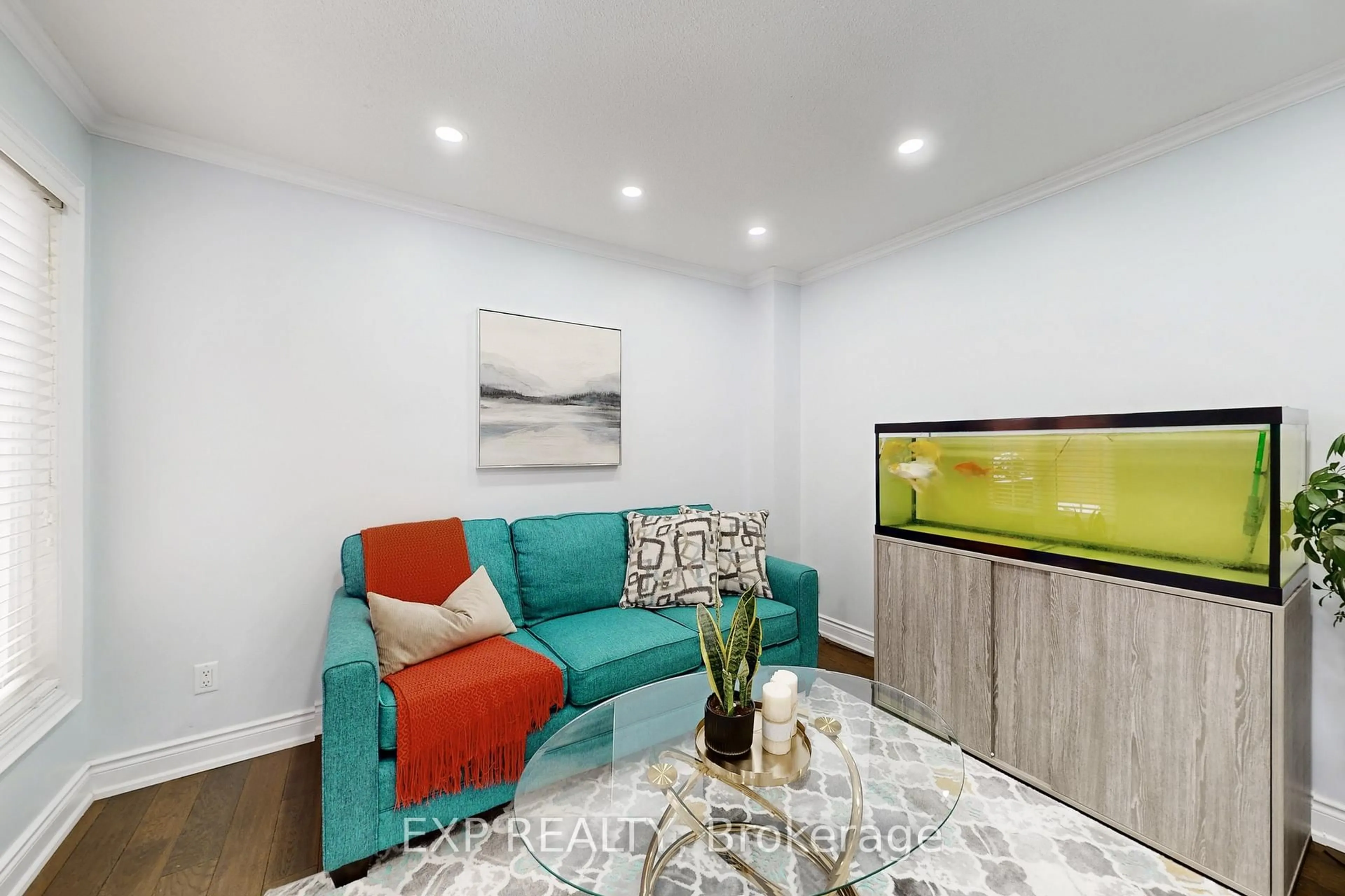 Living room with furniture, wood/laminate floor for 92 Hartrick Pl, Whitby Ontario L1R 2C3