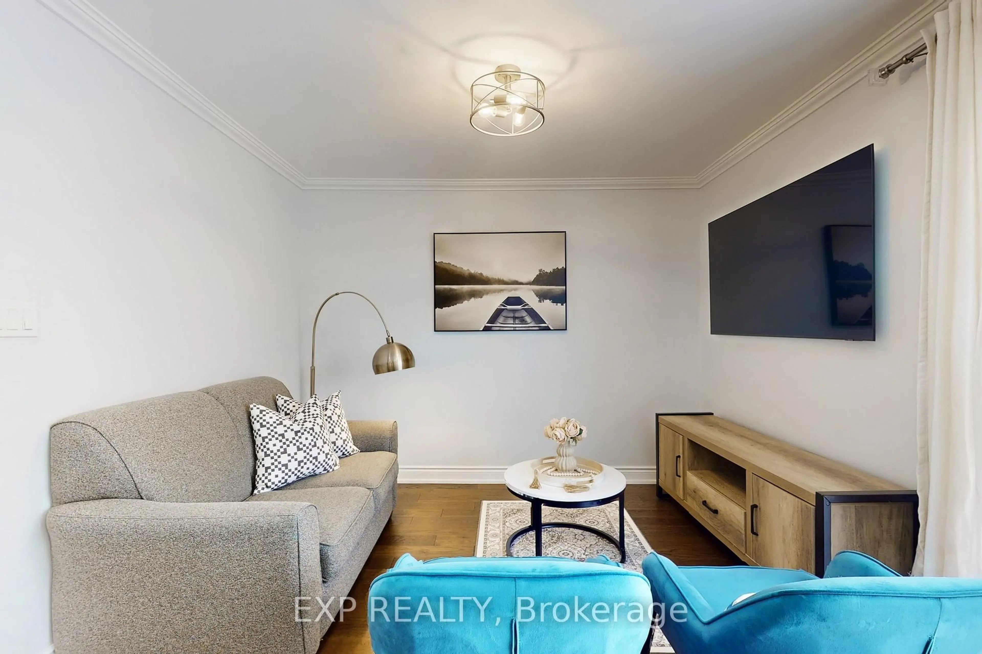 Living room with furniture, wood/laminate floor for 92 Hartrick Pl, Whitby Ontario L1R 2C3