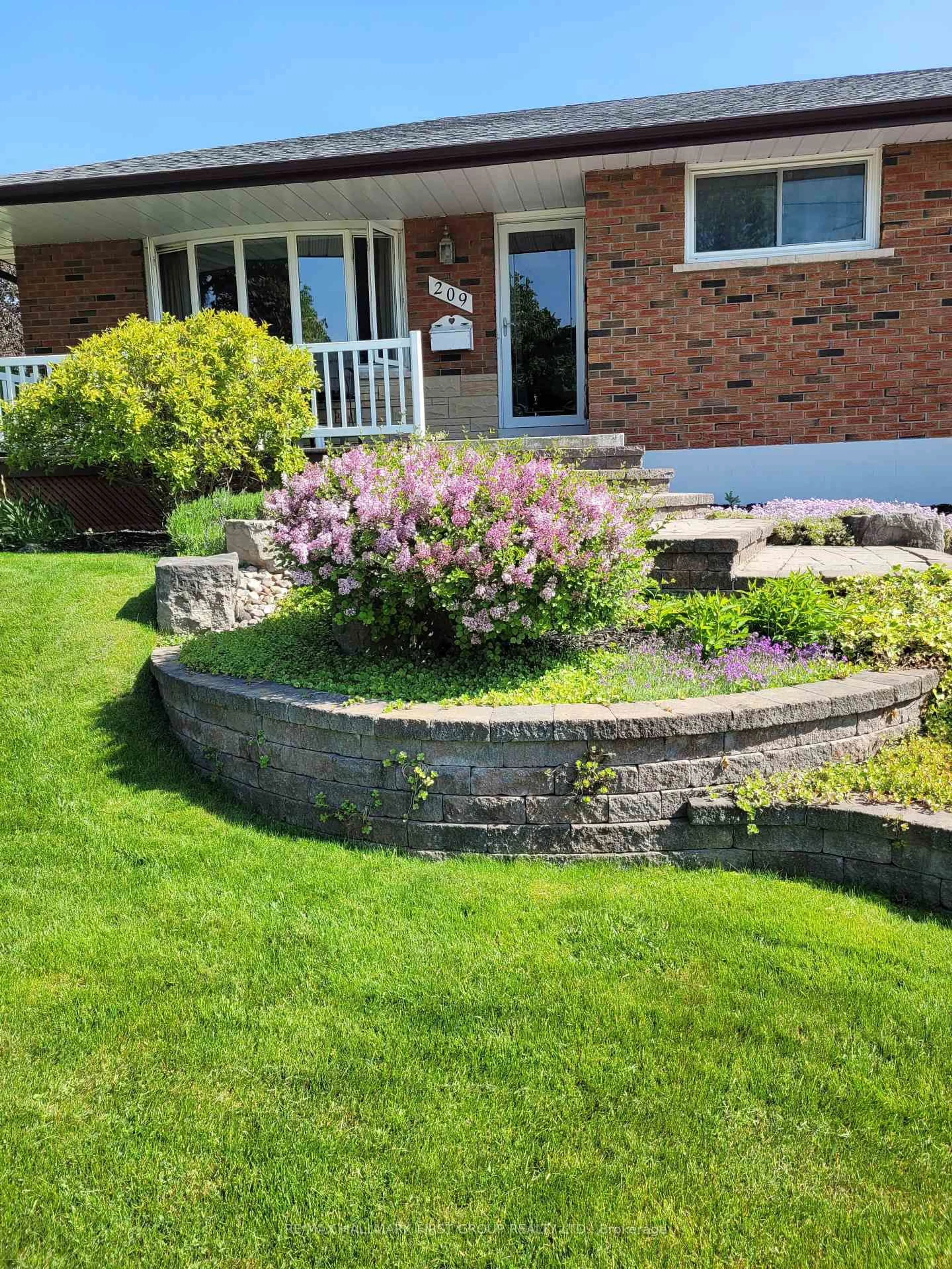 Home with brick exterior material, street for 209 Johnson Ave, Whitby Ontario L1N 3T2