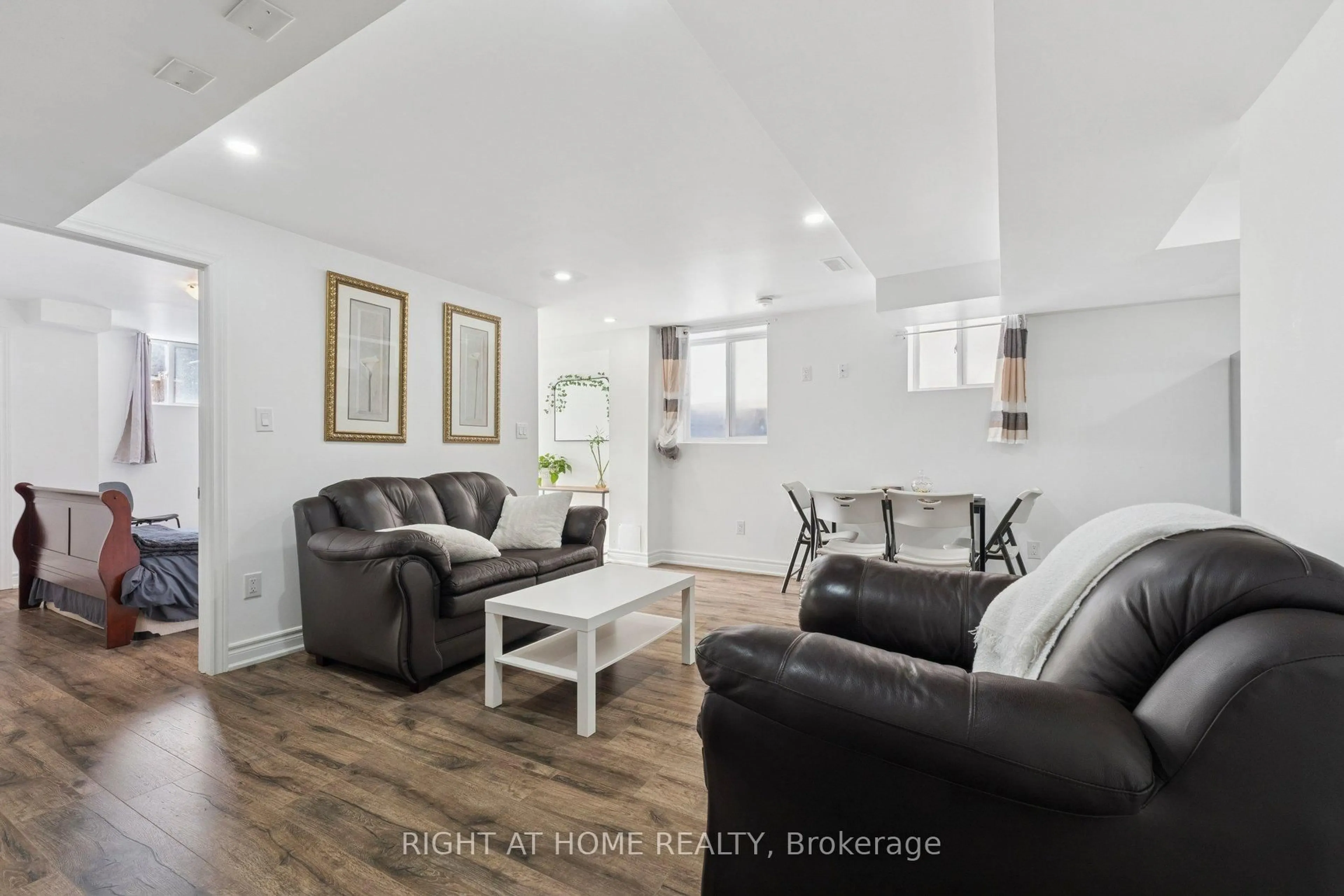 Living room with furniture, wood/laminate floor for 65 Marcelle Brunelle Dr, Whitby Ontario L1P 0G9