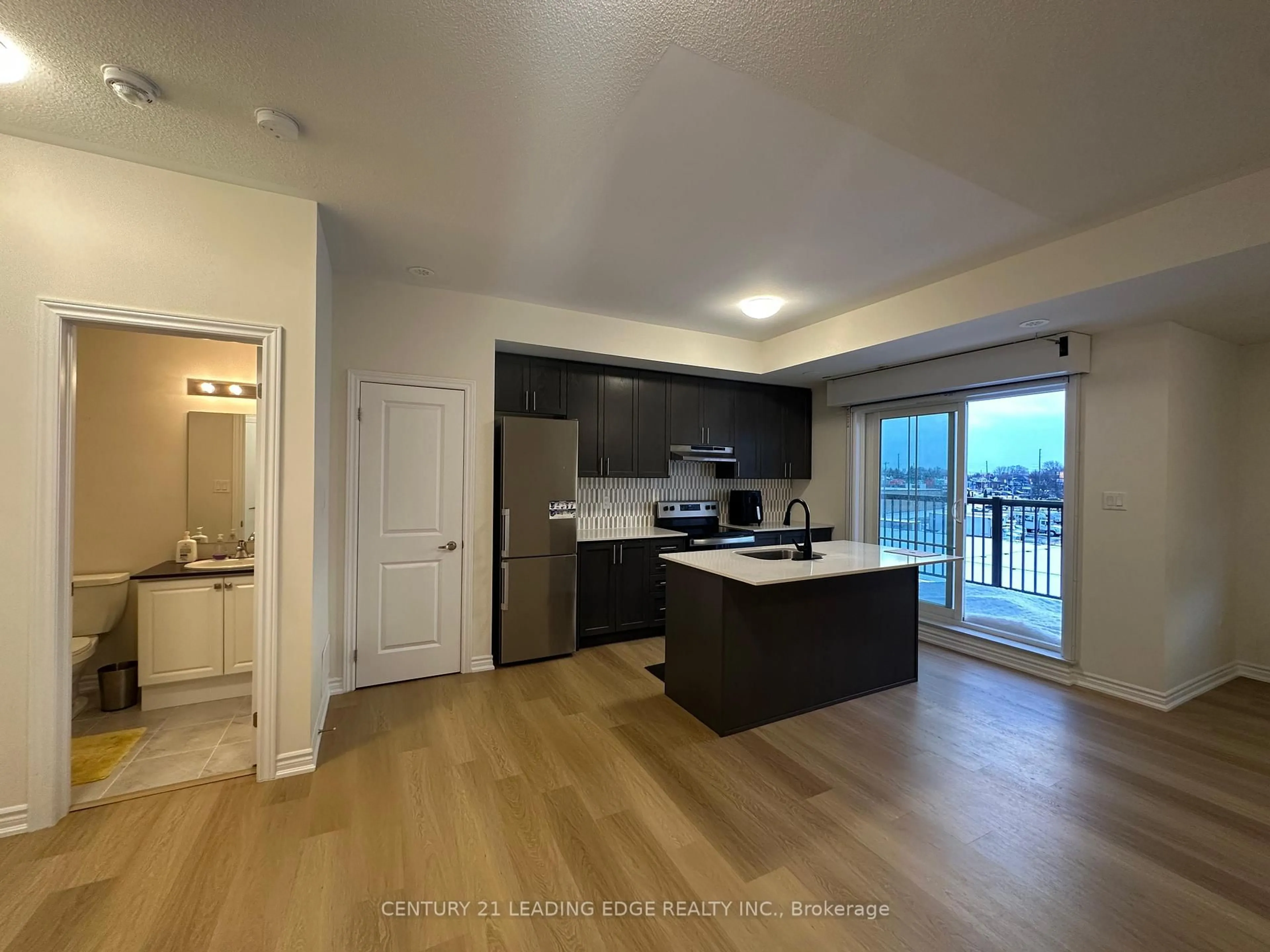 Open concept kitchen, wood/laminate floor for 480 Beresford Path #16, Oshawa Ontario L1H 0B2