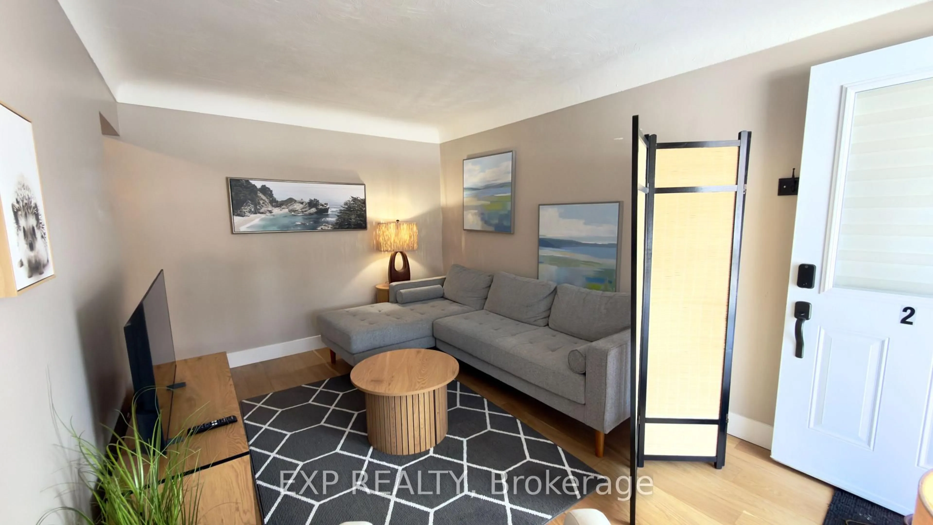 Living room with furniture, wood/laminate floor for 1515 Dufferin St, Whitby Ontario L1N 1B3