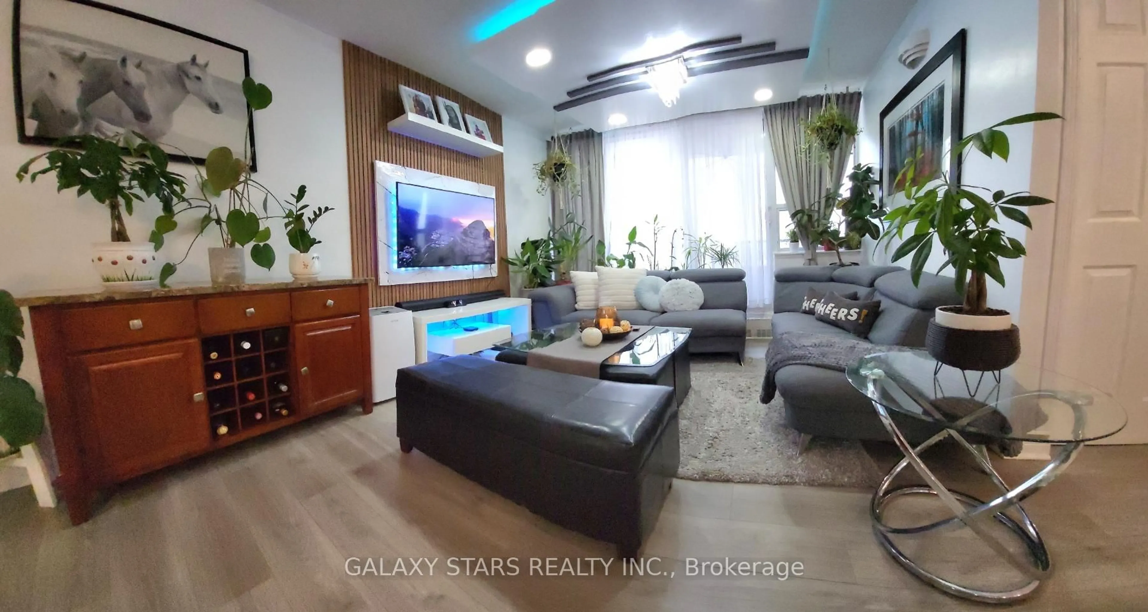 Living room with furniture, wood/laminate floor for 15 Torrance Rd #1210, Toronto Ontario M1J 3K2