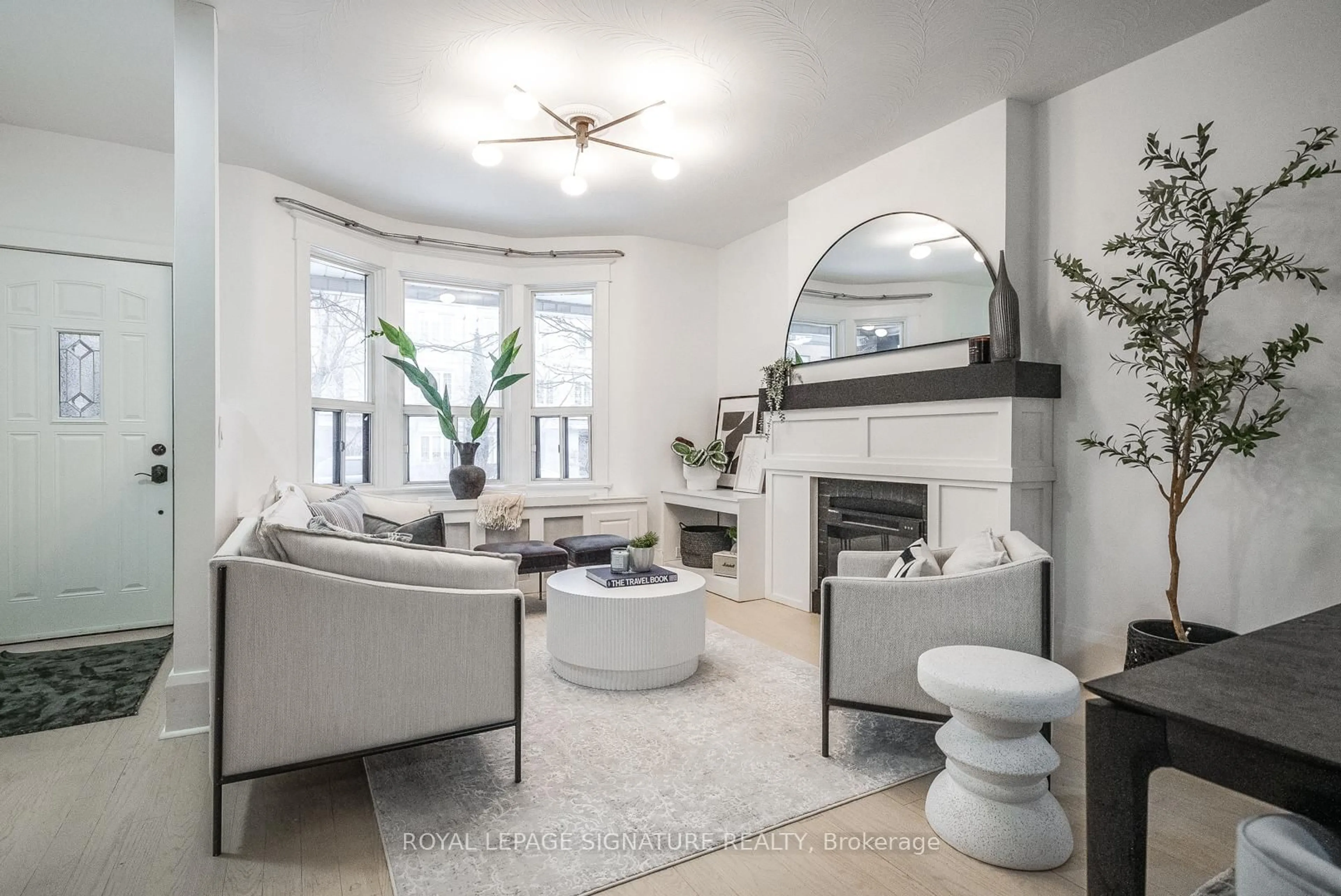 Living room with furniture, ceramic/tile floor for 216 Parkmount Rd, Toronto Ontario M4J 4V6