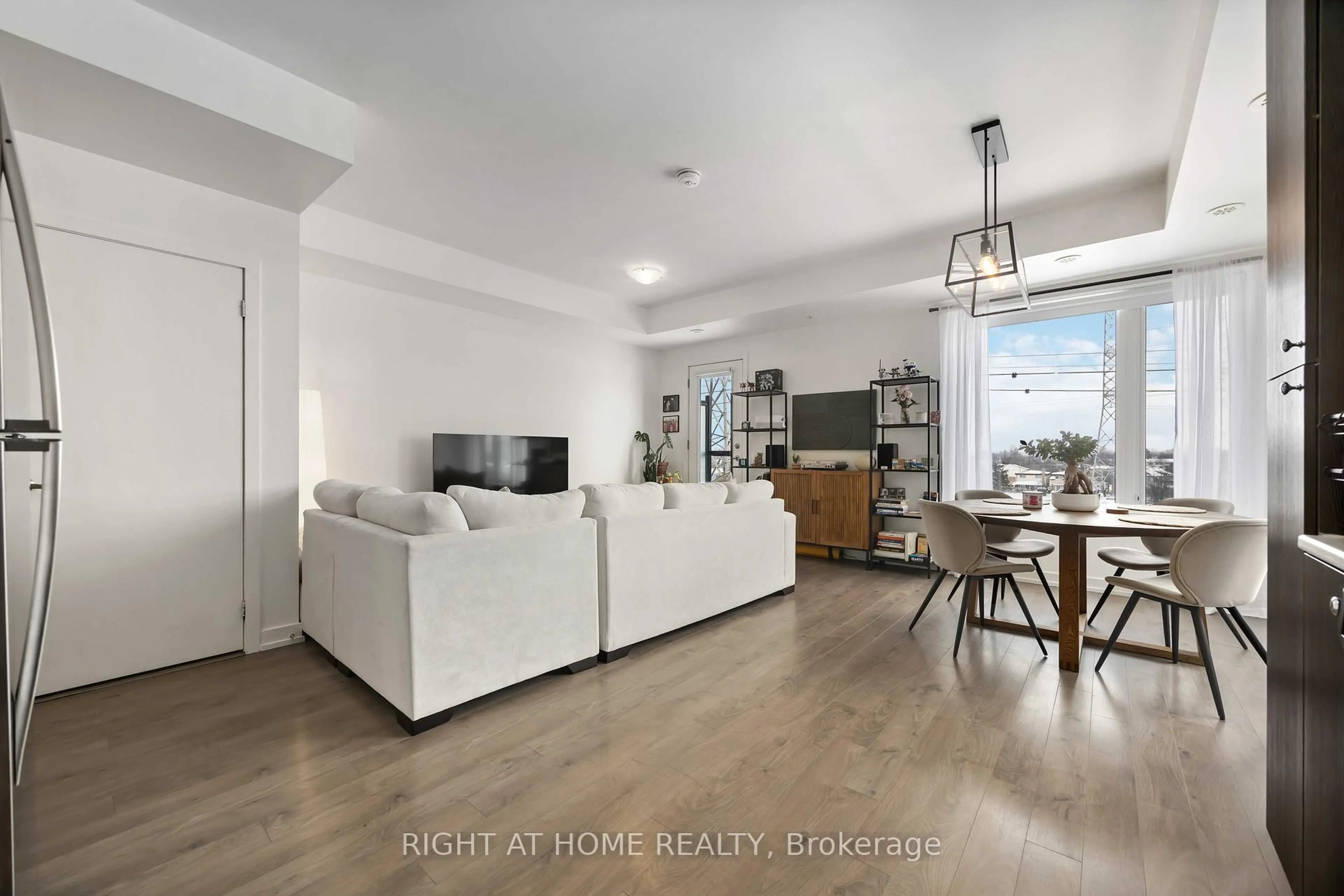 Living room with furniture, wood/laminate floor for 1555 Kingston Rd #220, Pickering Ontario L1V 0E9