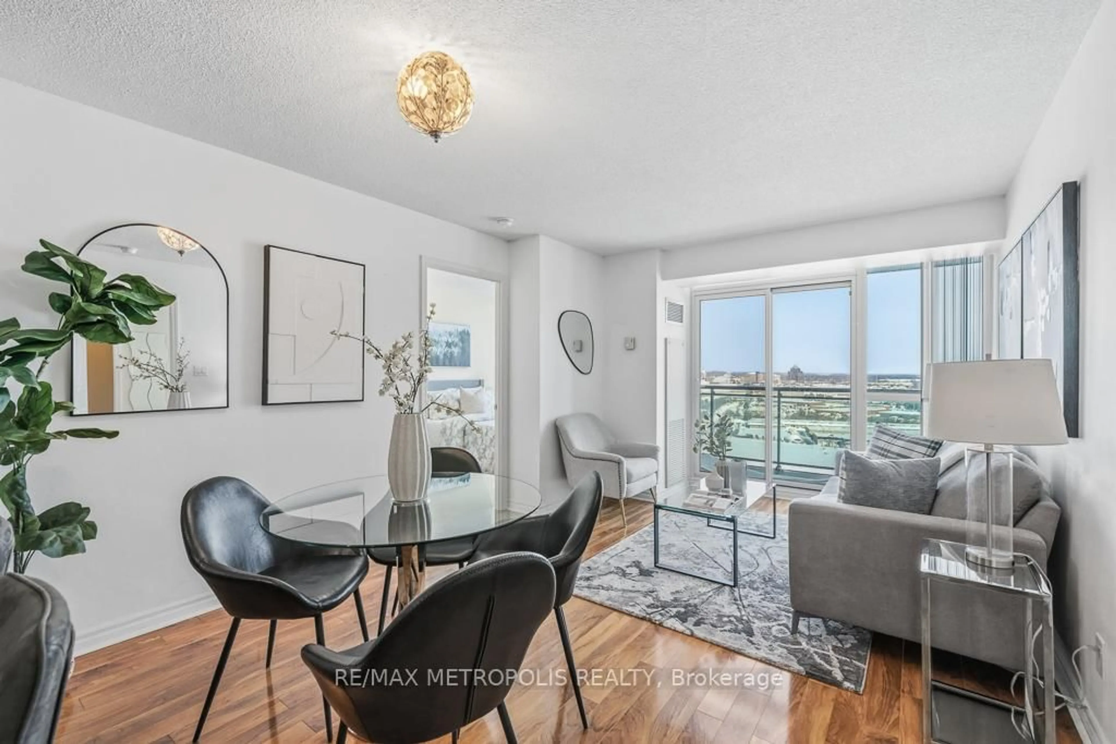 Living room with furniture, wood/laminate floor for 88 Grangeway Ave #2007, Toronto Ontario M1H 0A2