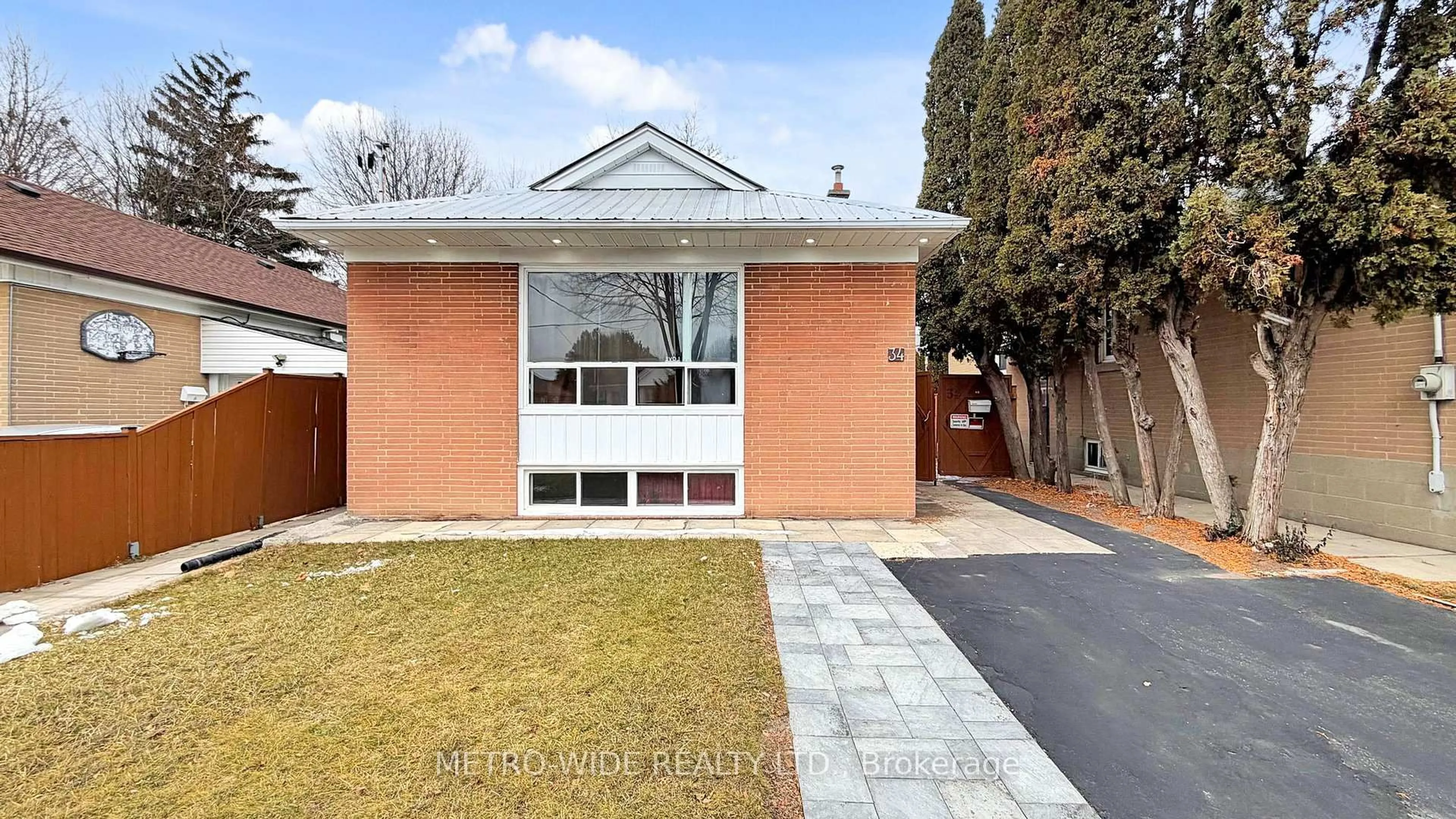 Home with brick exterior material, street for 34 Merrian Rd, Toronto Ontario M1K 3M7