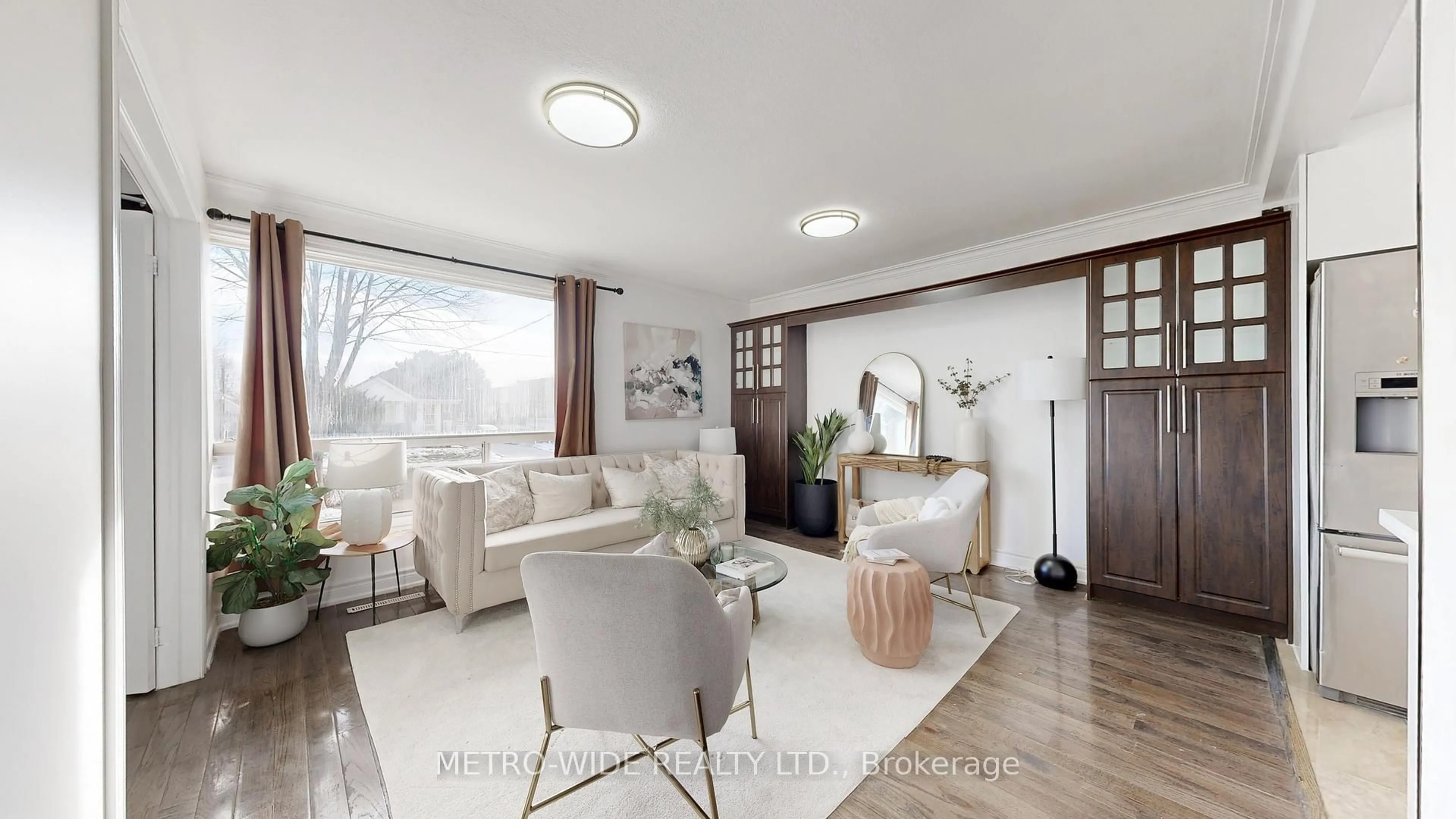 Living room with furniture, wood/laminate floor for 34 Merrian Rd, Toronto Ontario M1K 3M7