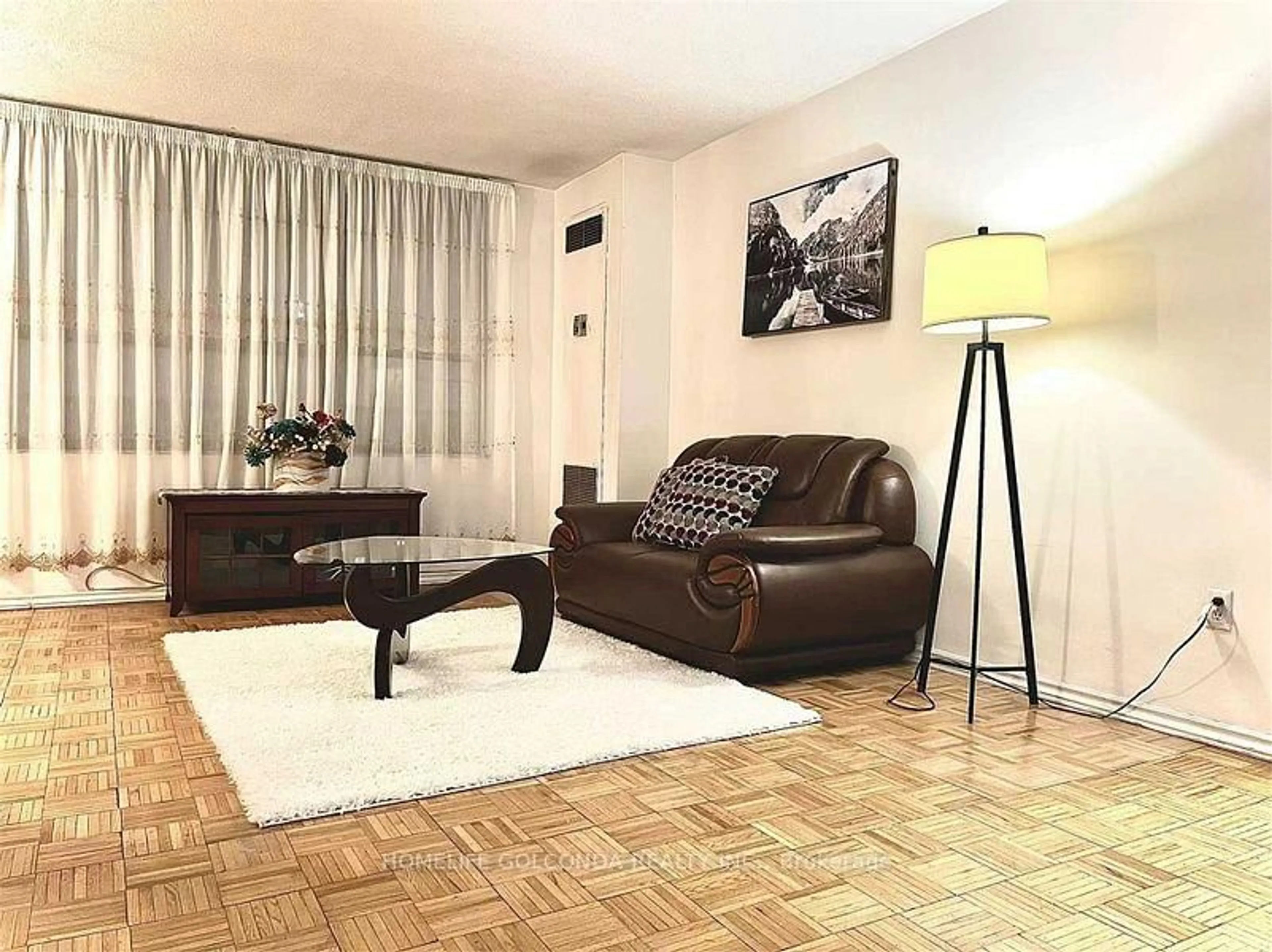 Living room with furniture, wood/laminate floor for 2721 Victoria Park Ave #1004, Toronto Ontario M1T 3N6