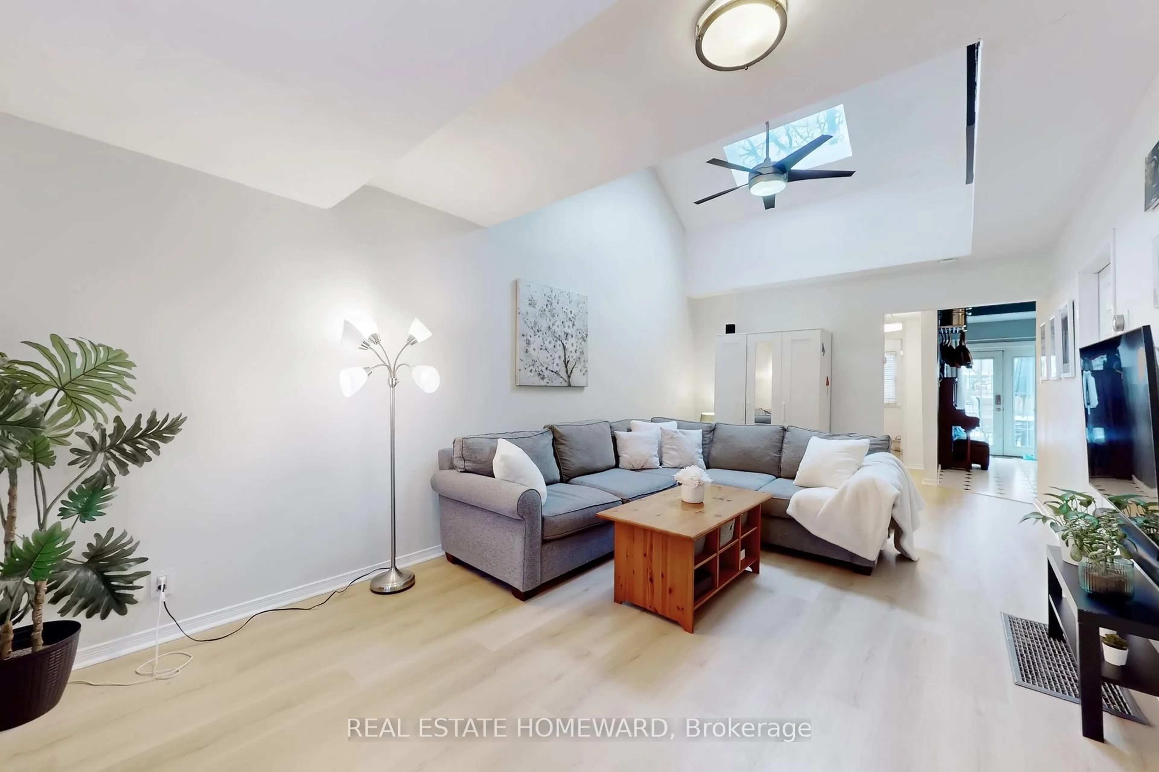 Living room with furniture, wood/laminate floor for 127 Kalmar Ave, Toronto Ontario M1N 3G6