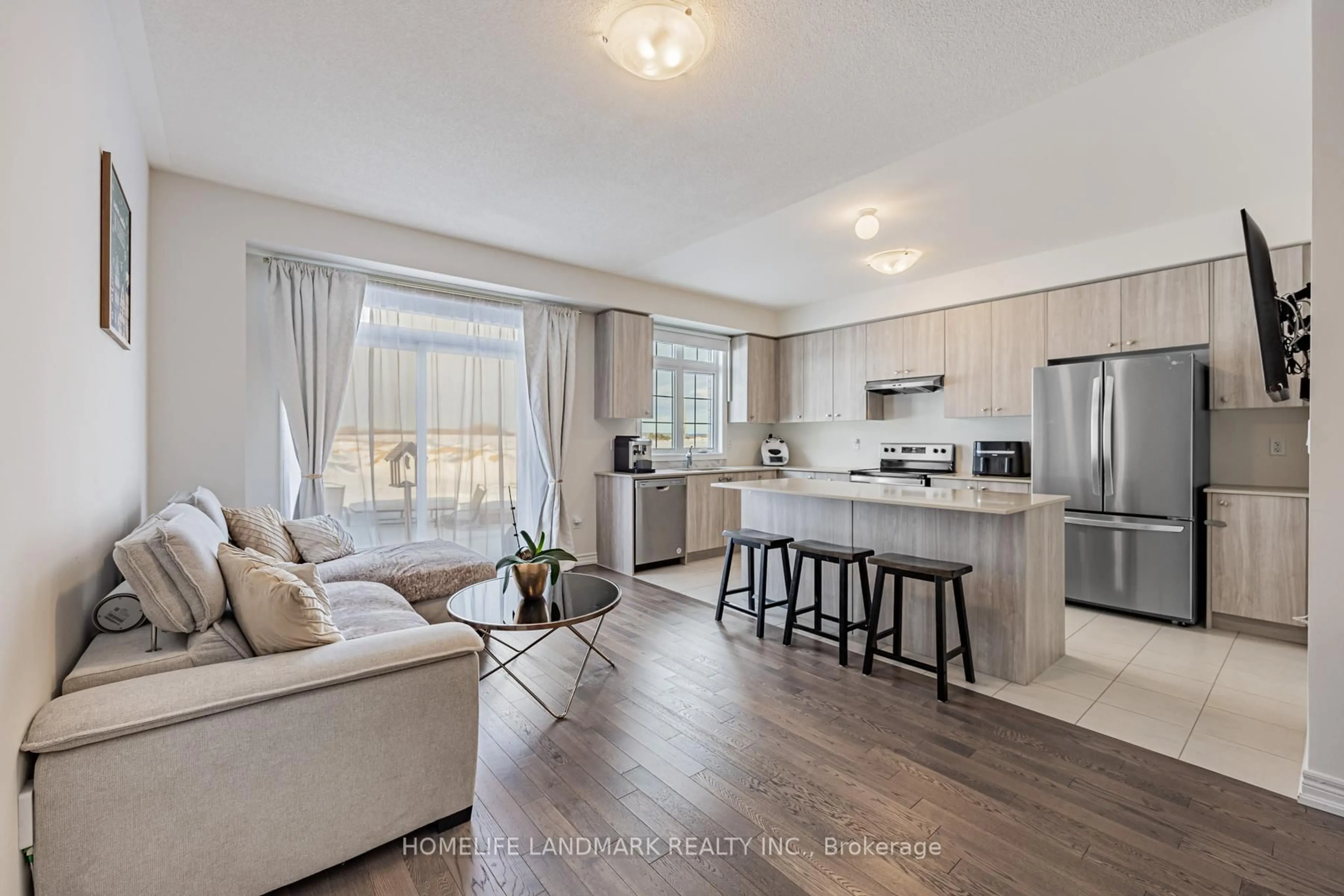 Open concept kitchen, wood/laminate floor for 1102 Pisces Tr, Pickering Ontario L1X 0P8