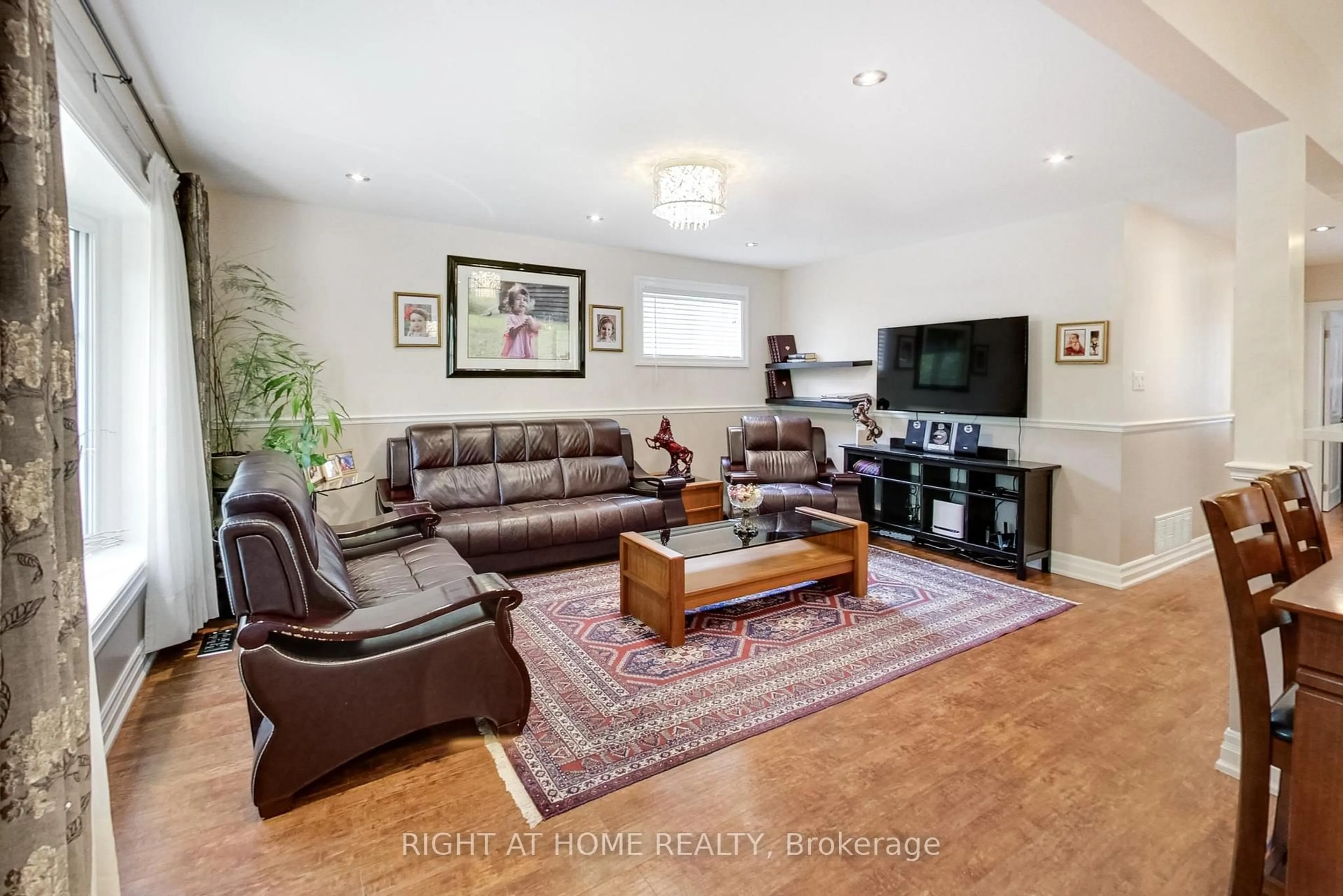 Living room with furniture, wood/laminate floor for 8 Suraty Ave, Toronto Ontario M1P 4E1