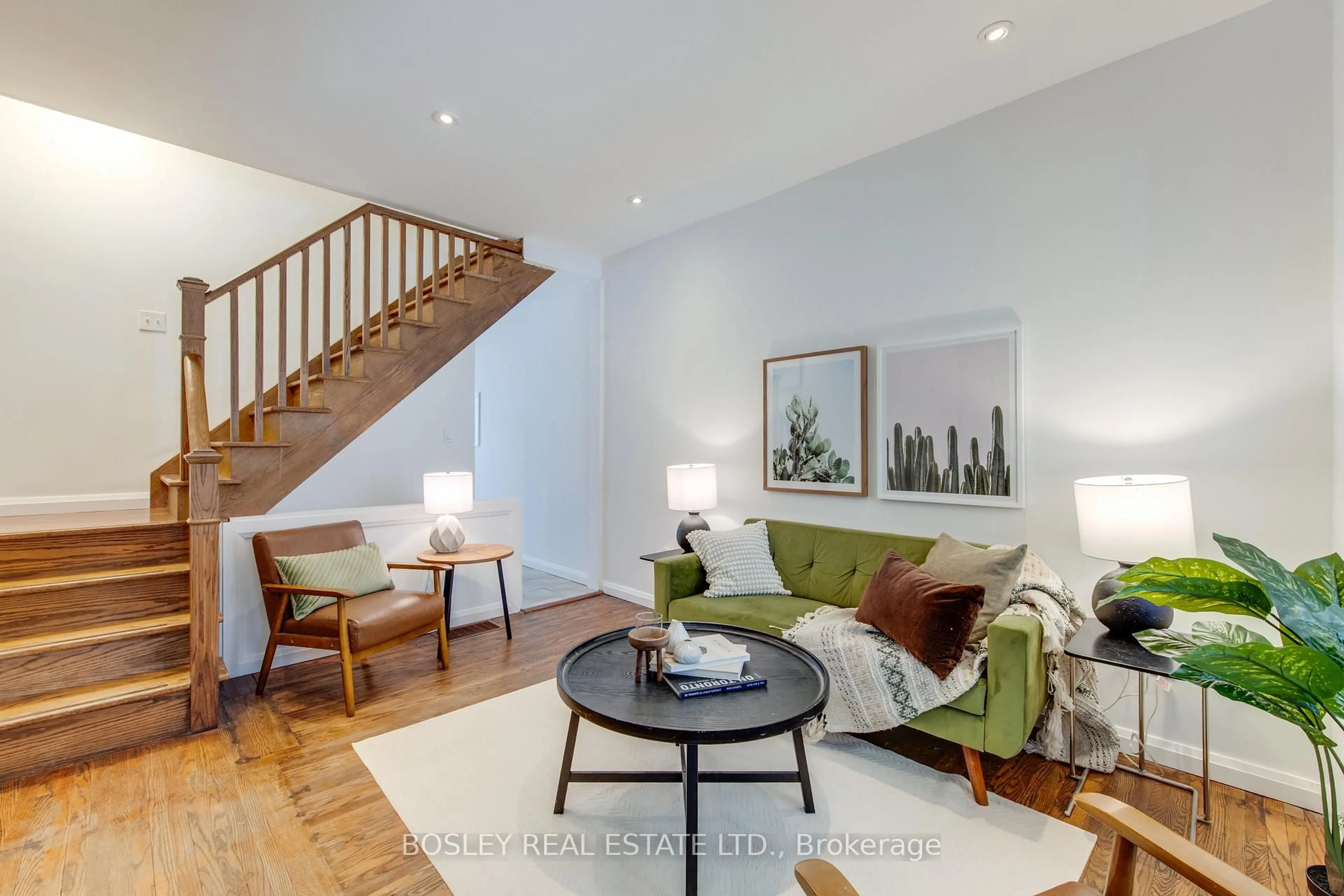 Living room with furniture, wood/laminate floor for 166 Hiawatha Rd, Toronto Ontario M4L 2X9