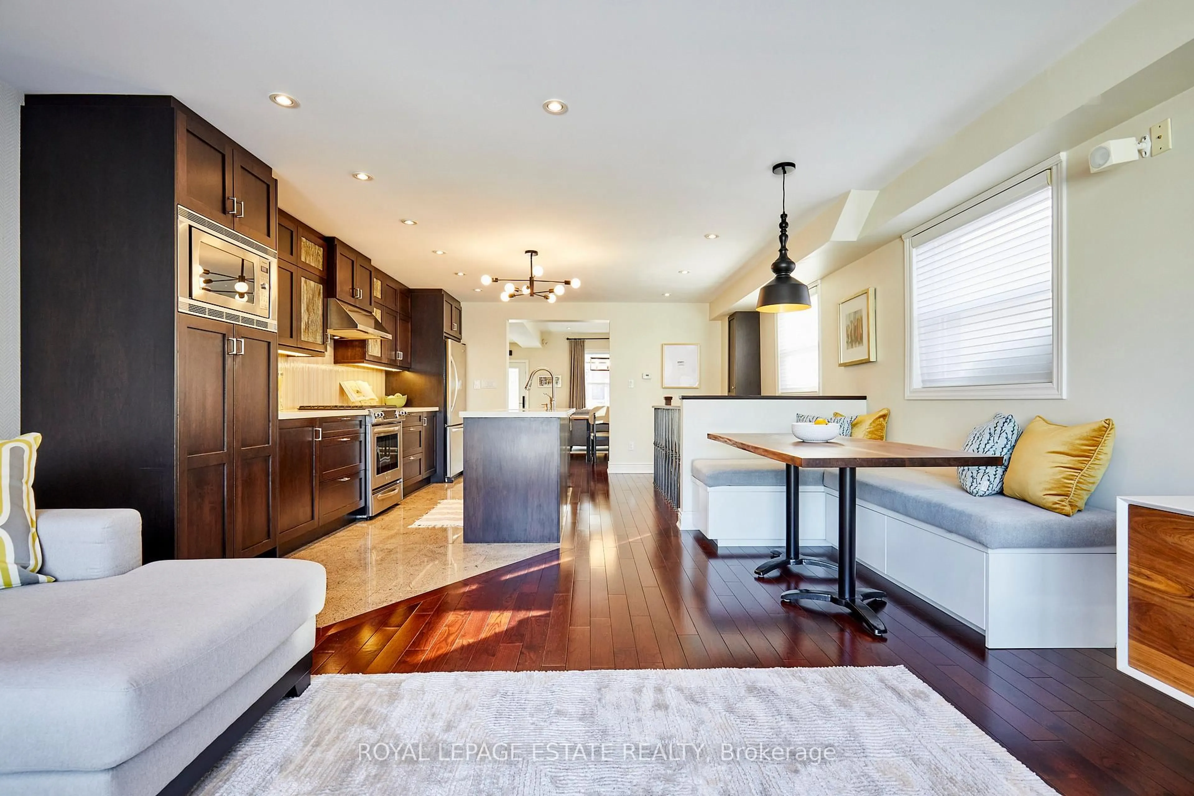 Open concept kitchen, wood/laminate floor for 108 Barker Ave, Toronto Ontario M4C 2N9