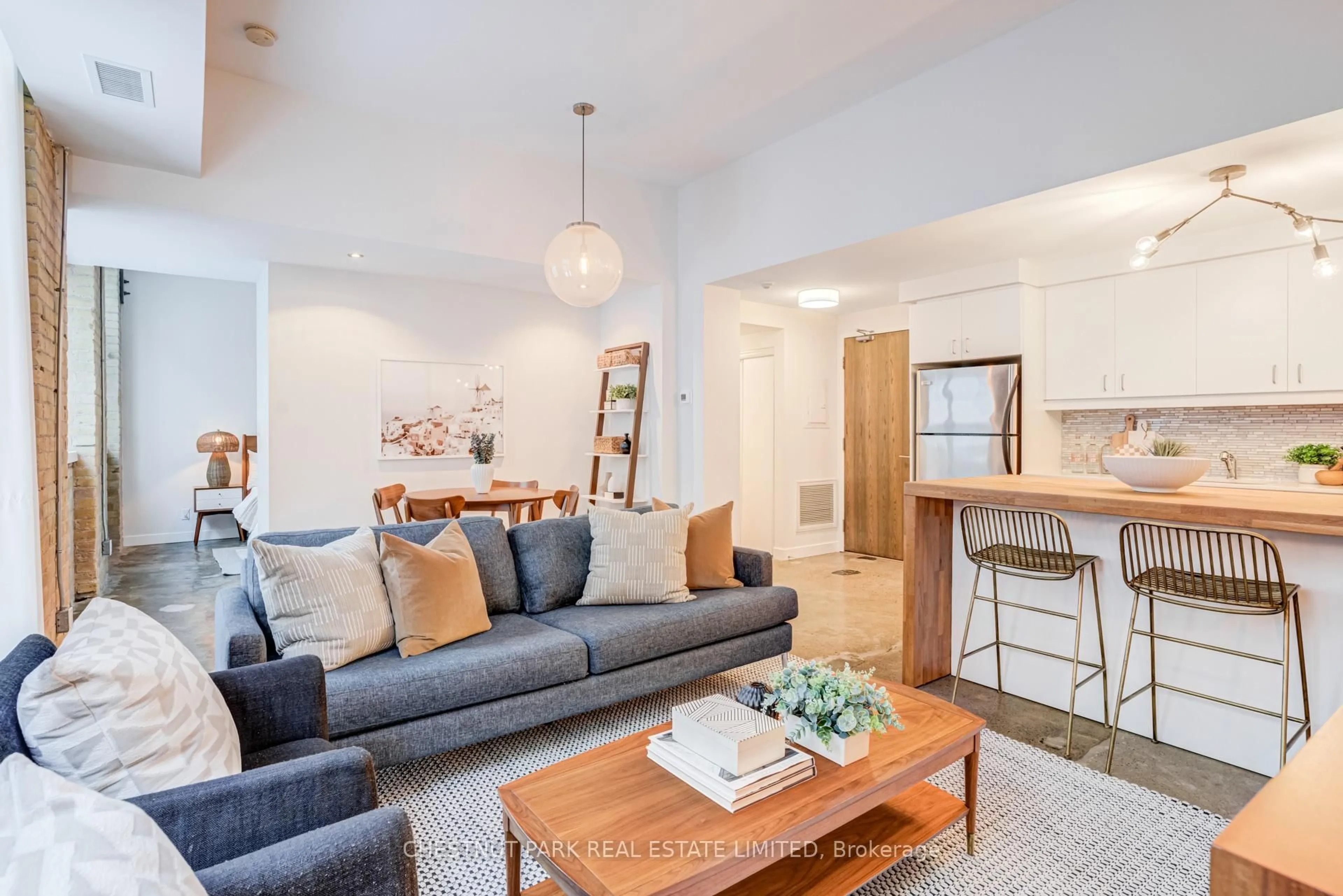 Living room with furniture, unknown for 201 Carlaw Ave #225, Toronto Ontario M4M 2S3