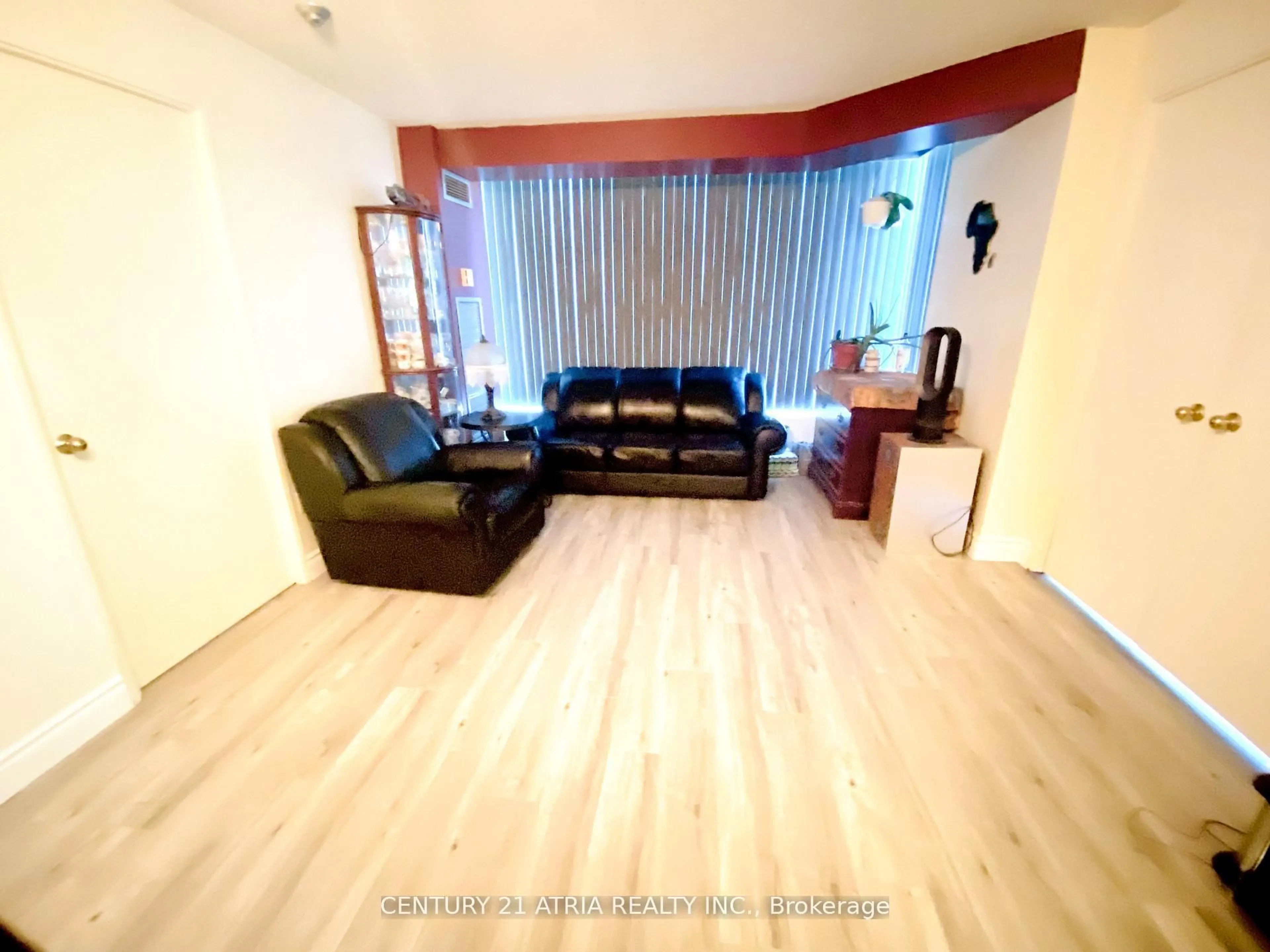 Living room with furniture, wood/laminate floor for 3050 Ellesmere Rd #505, Toronto Ontario M1E 5E6