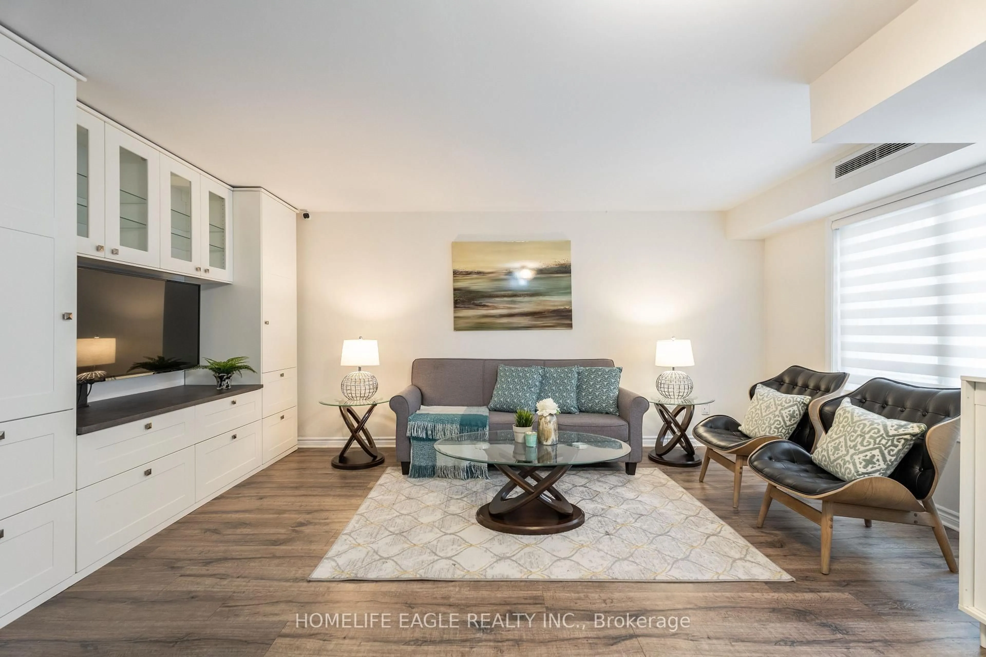 Living room with furniture, unknown for 1483 Birchmount Rd #101, Toronto Ontario M1P 0C7