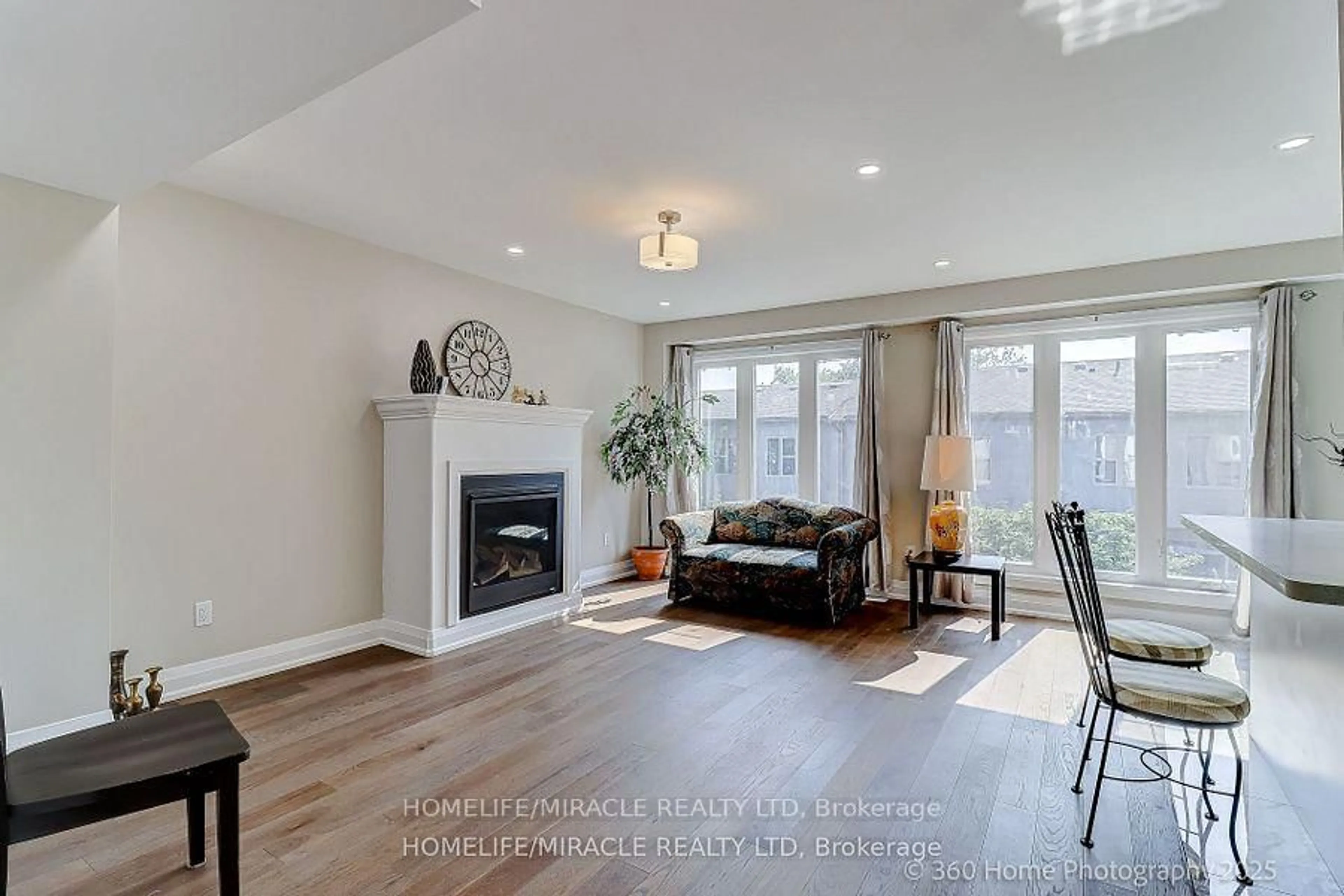 Living room with furniture, wood/laminate floor for 688A Midland Ave, Toronto Ontario M1K 4C6