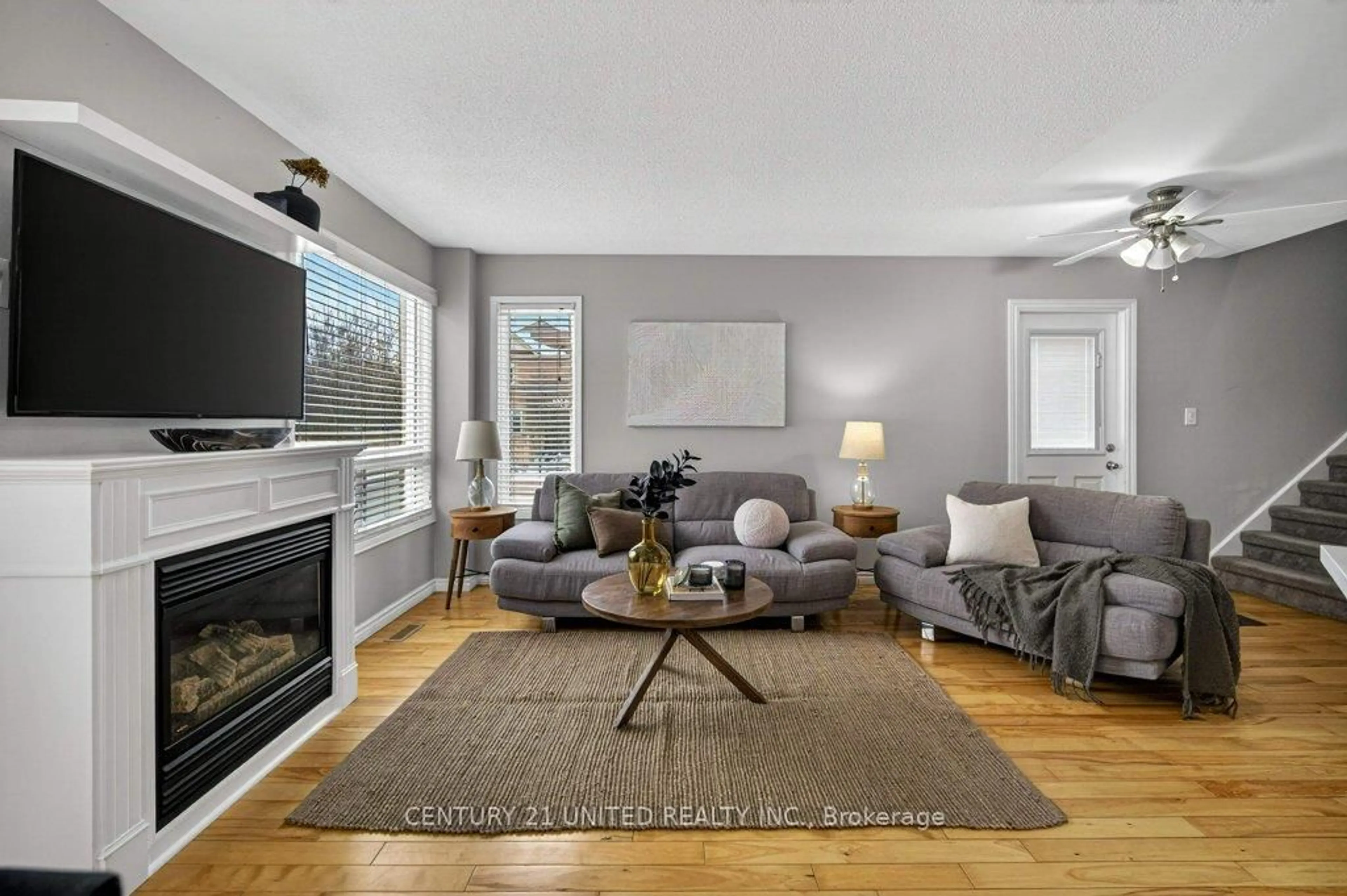 Living room with furniture, wood/laminate floor for 1780 Woodgate Tr, Oshawa Ontario L1G 8B3