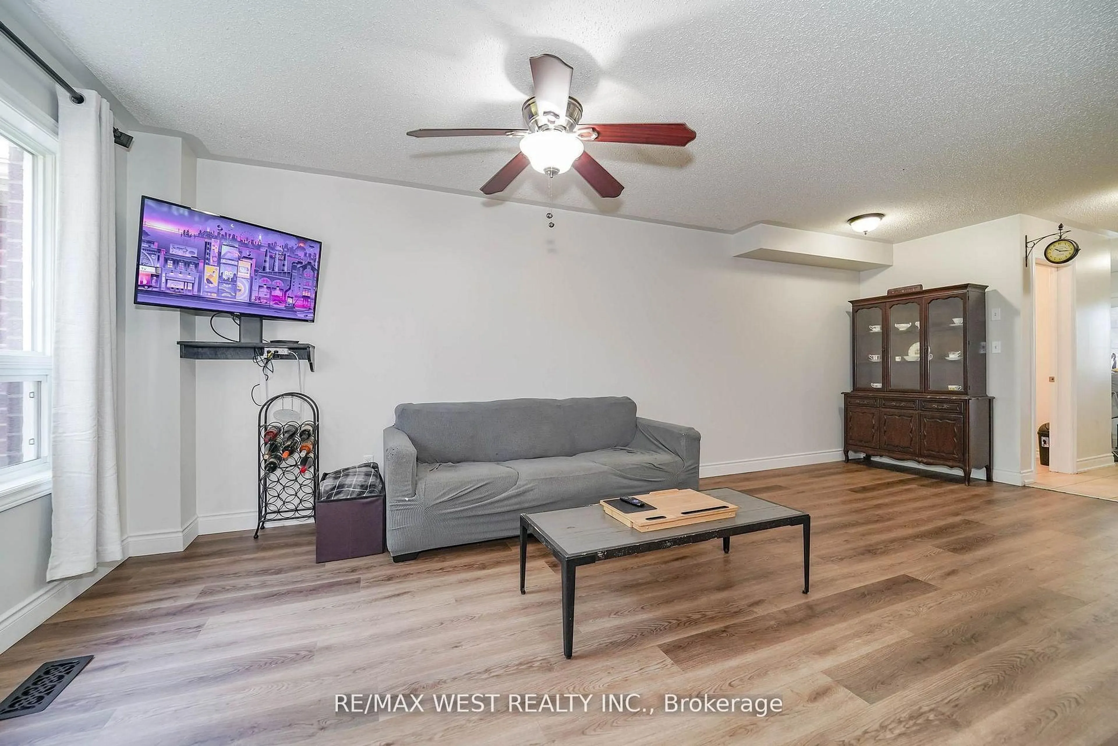 Living room with furniture, wood/laminate floor for 715 Grandview St #36, Oshawa Ontario L1K 0N2
