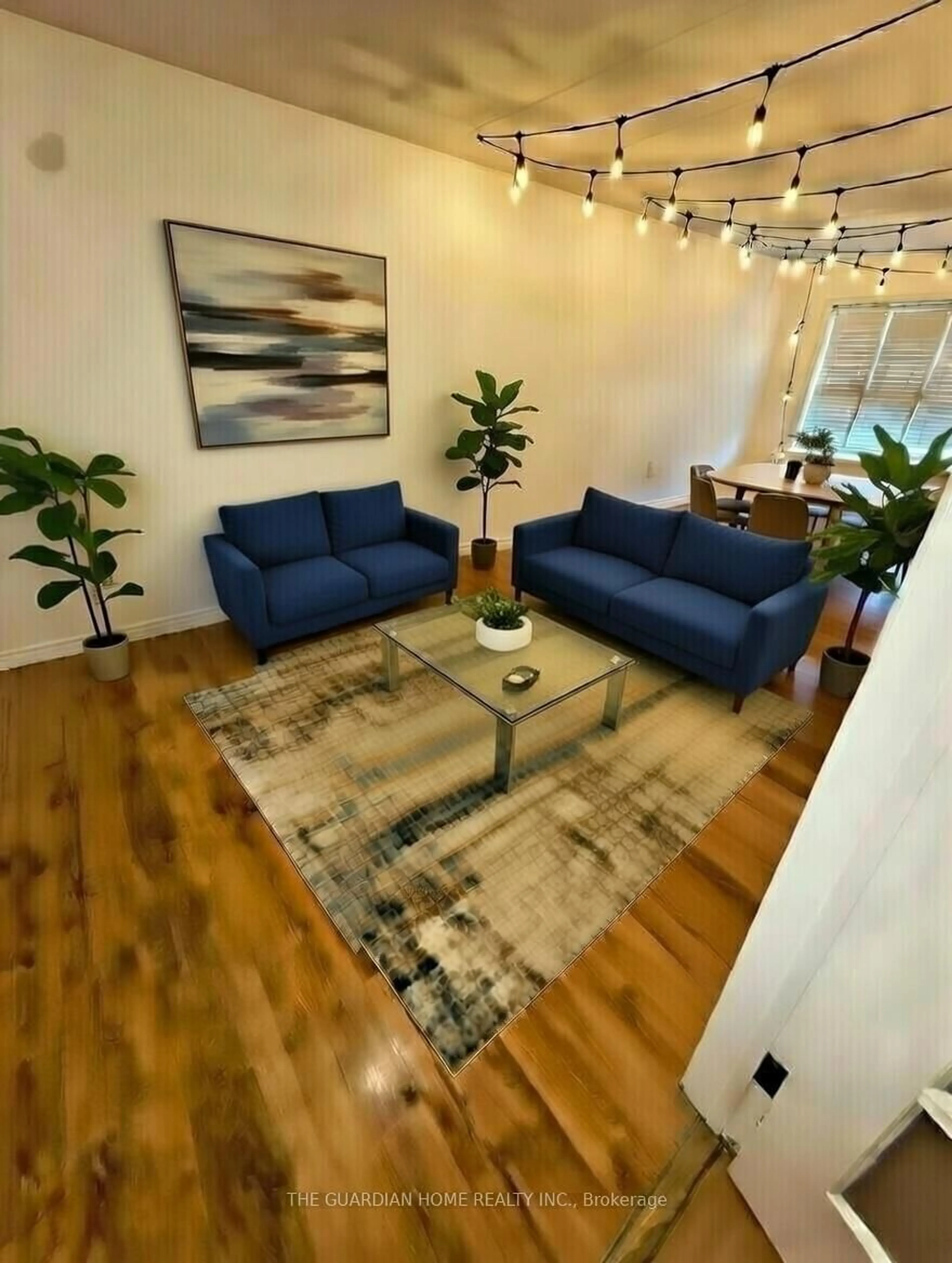 Living room with furniture, wood/laminate floor for 17 Goldring Dr, Whitby Ontario L1P 1B9