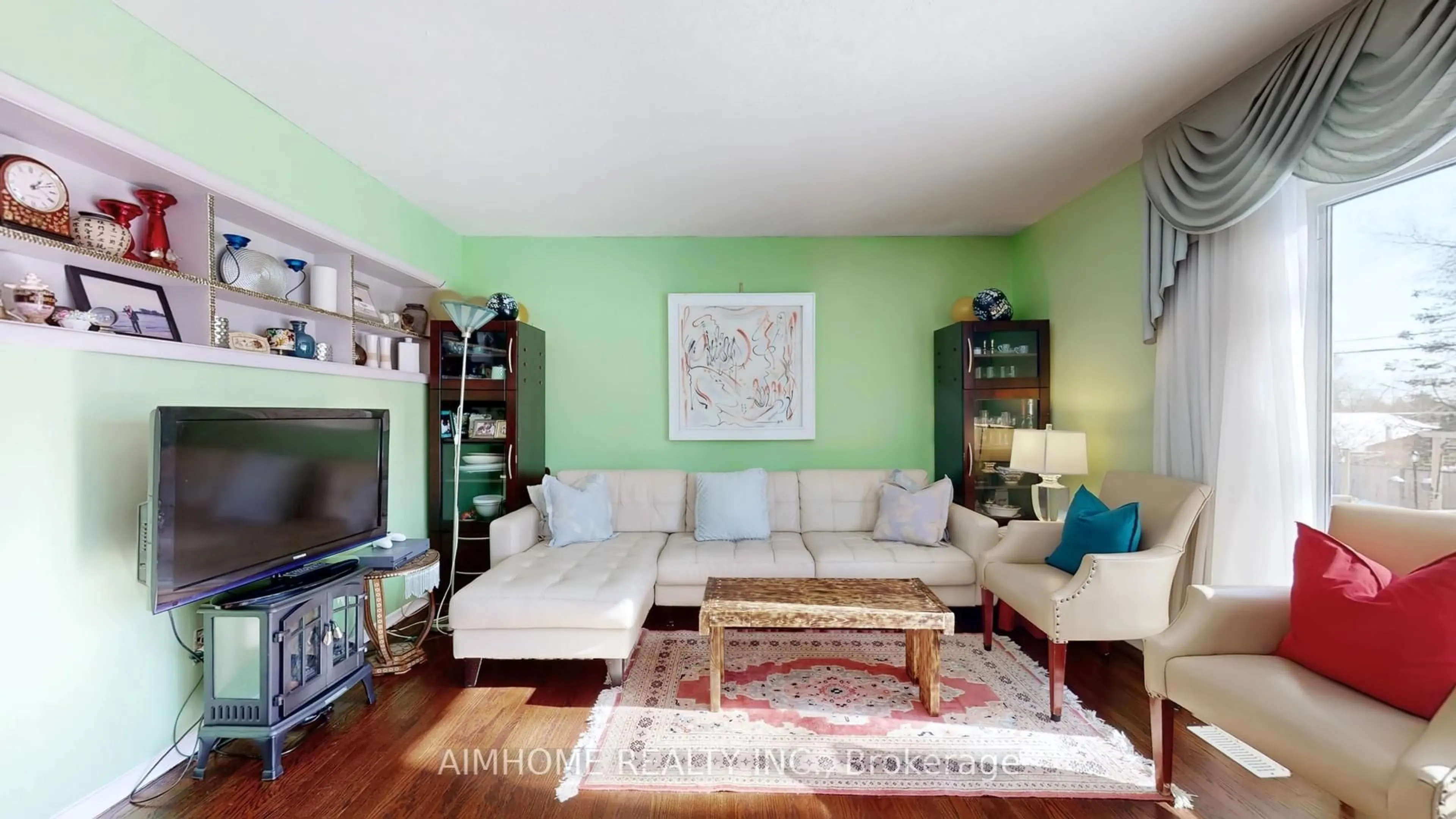 Living room with furniture, wood/laminate floor for 913 Brimorton Dr, Toronto Ontario M1G 2T8