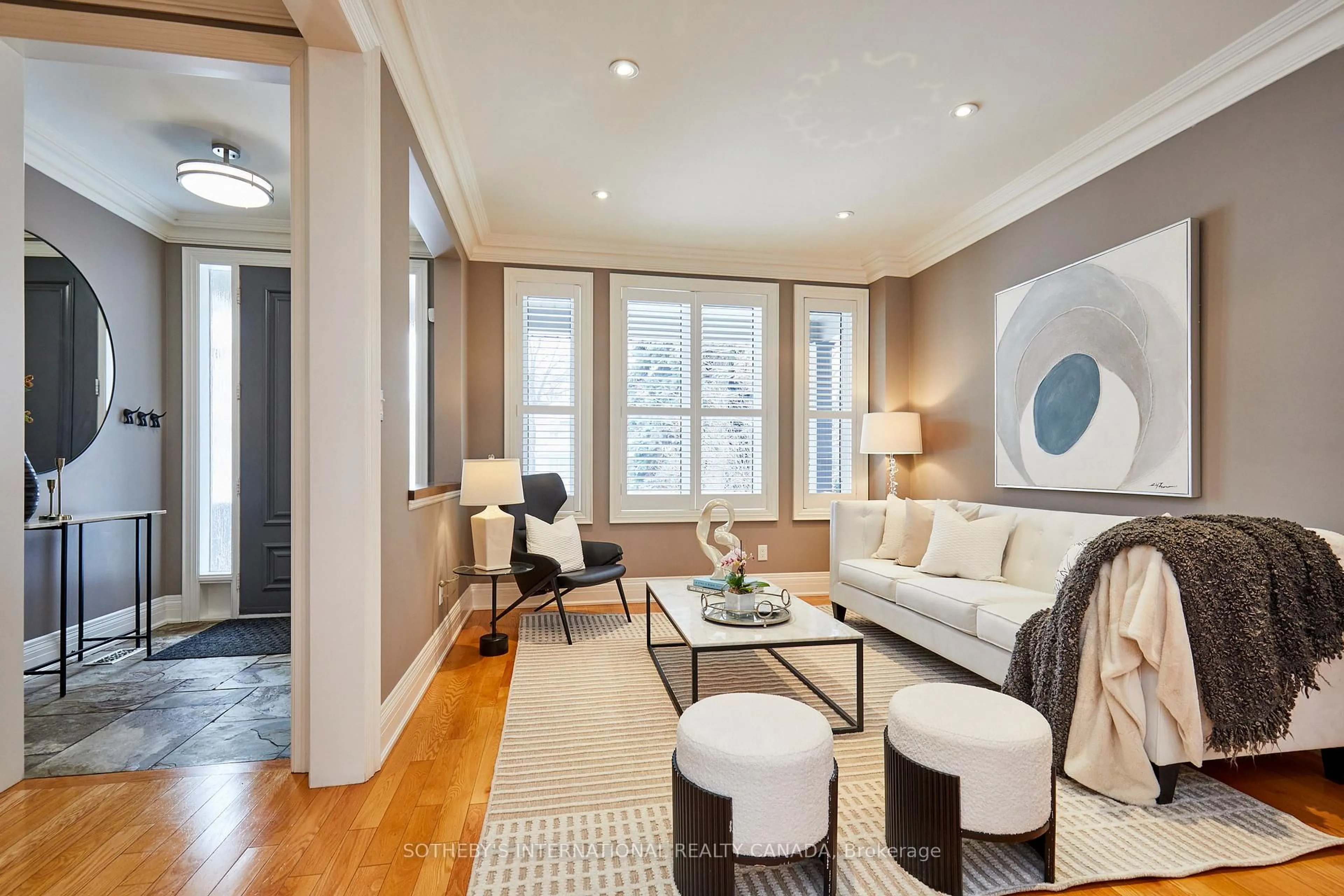 Living room with furniture, wood/laminate floor for 64A Eastville Ave, Toronto Ontario M1M 2N9