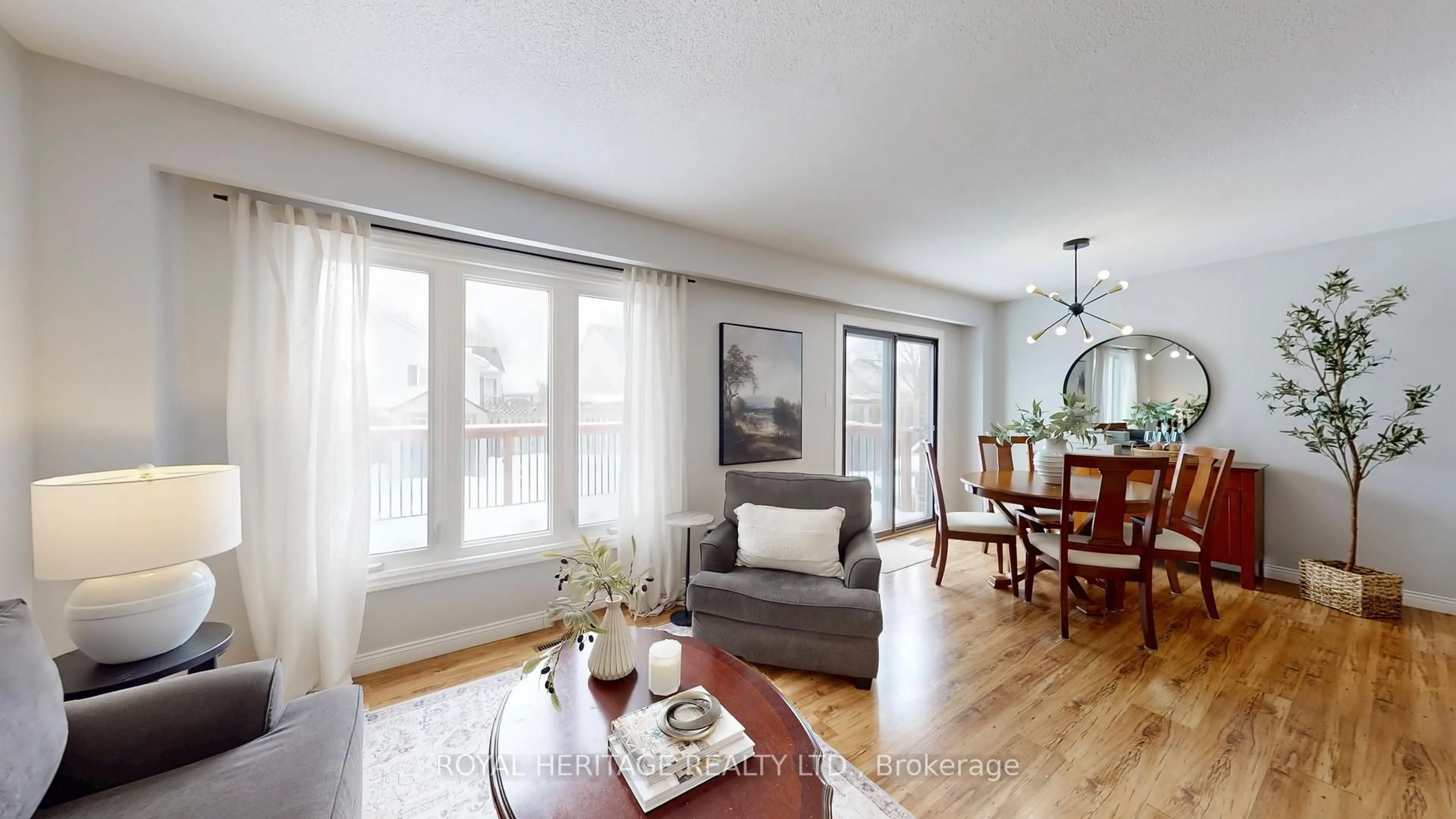 Living room with furniture, wood/laminate floor for 8 Burden Cres, Ajax Ontario L1T 3T8