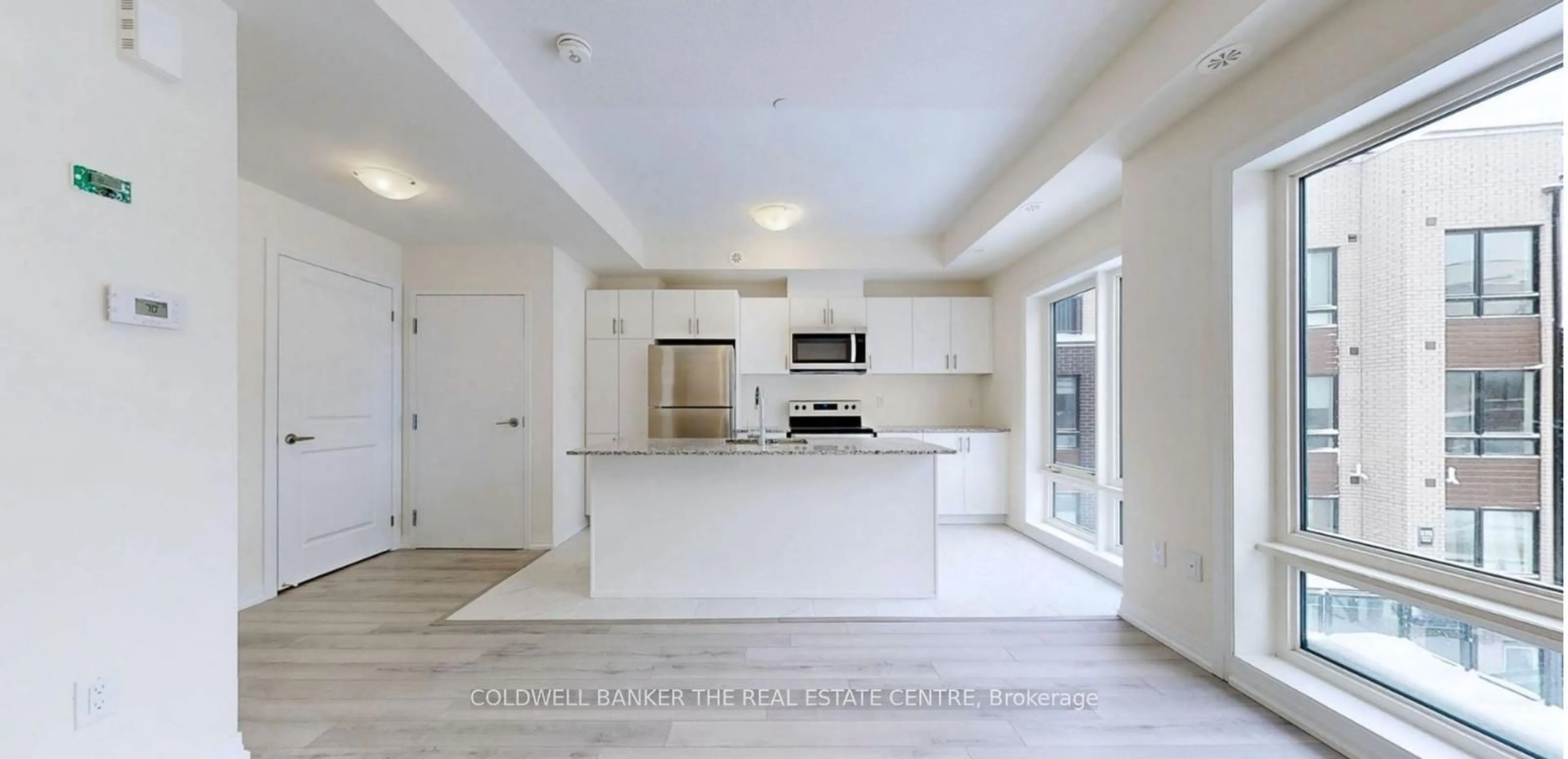 Open concept kitchen, ceramic/tile floor for 165 Tapscott Rd #32, Toronto Ontario M1B 0E8