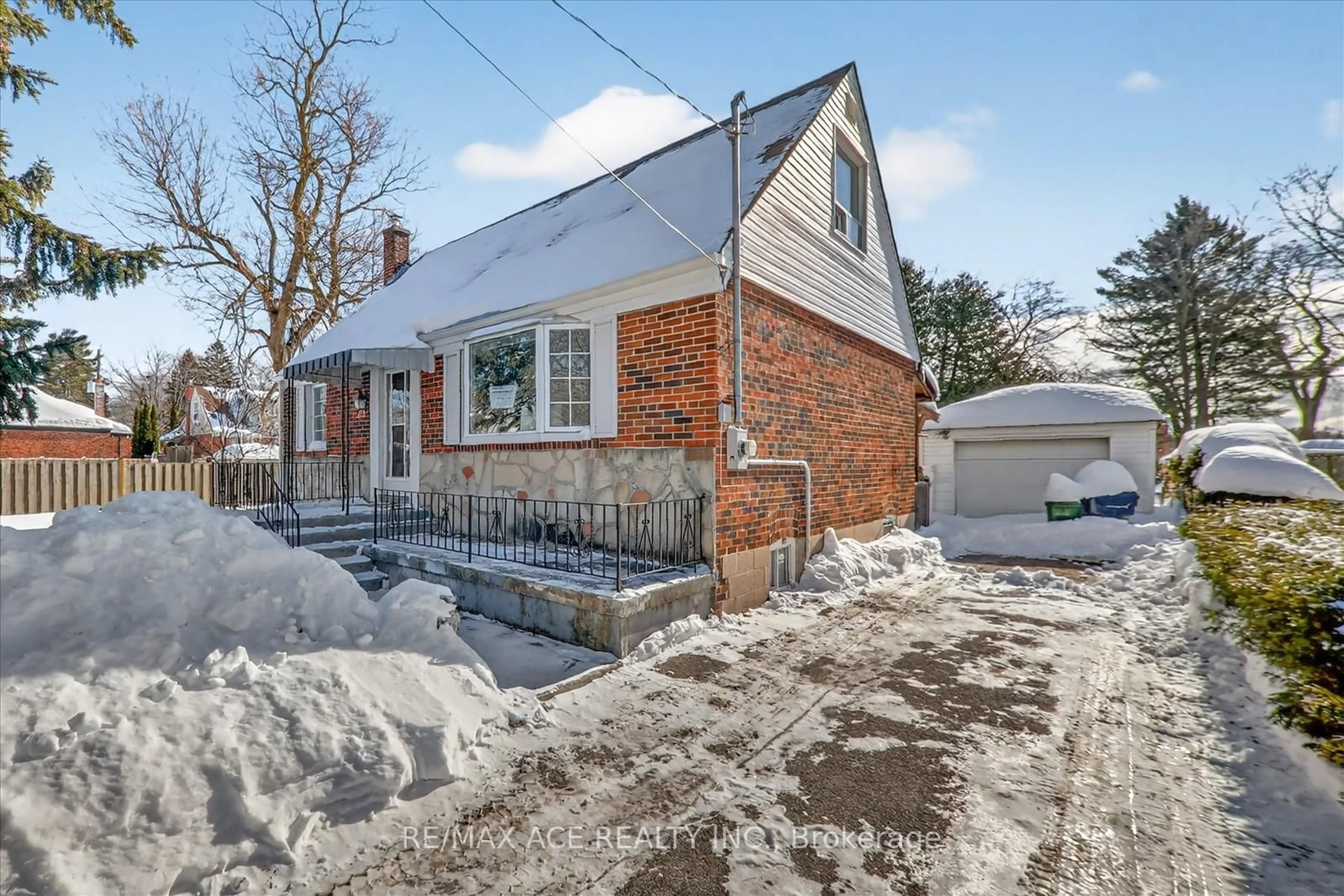 Home with brick exterior material, street for 233 Oakridge Dr, Toronto Ontario M1M 2B5
