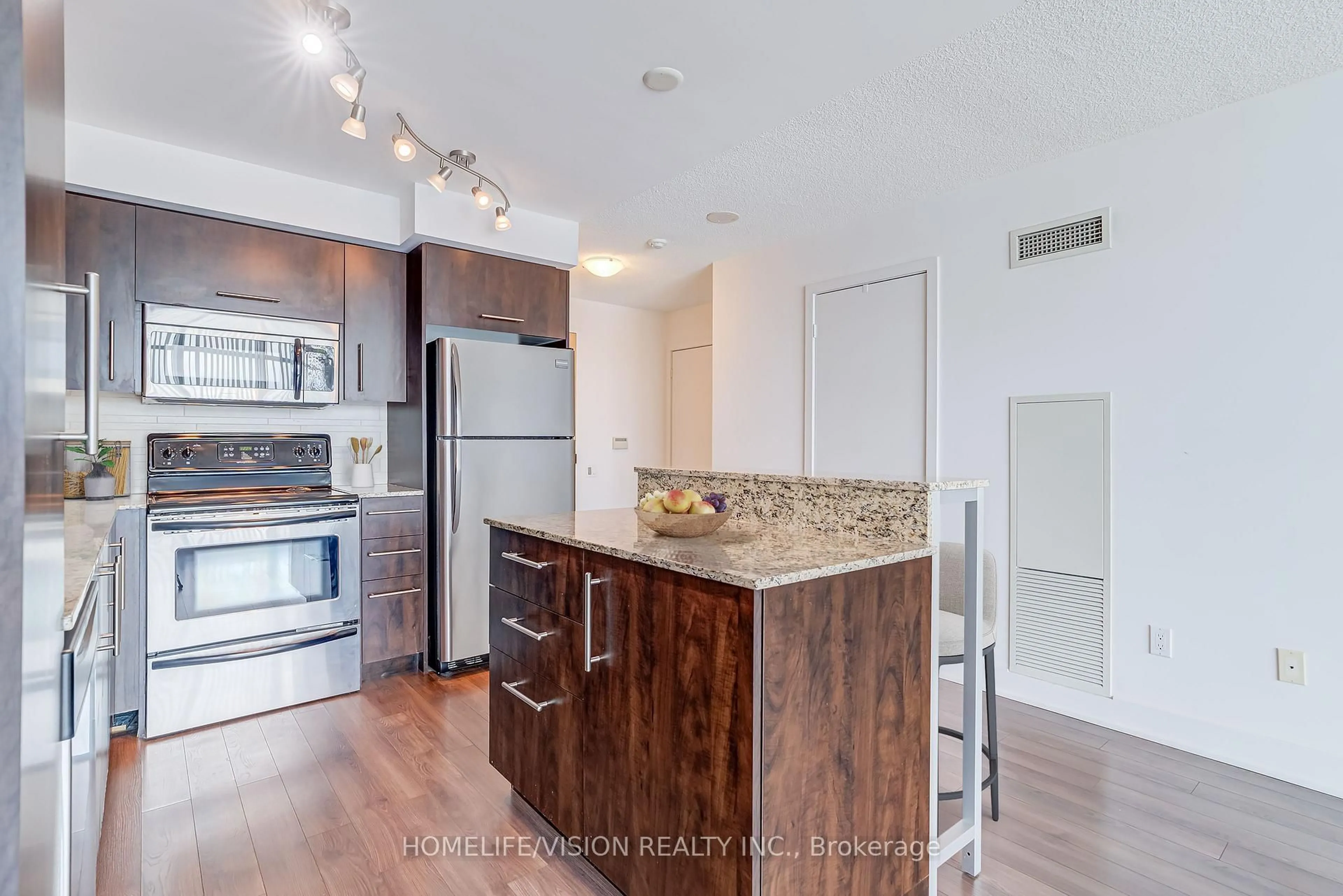 Open concept kitchen, wood/laminate floor for 1048 Broadview Ave #1907, Toronto Ontario M4K 2B8