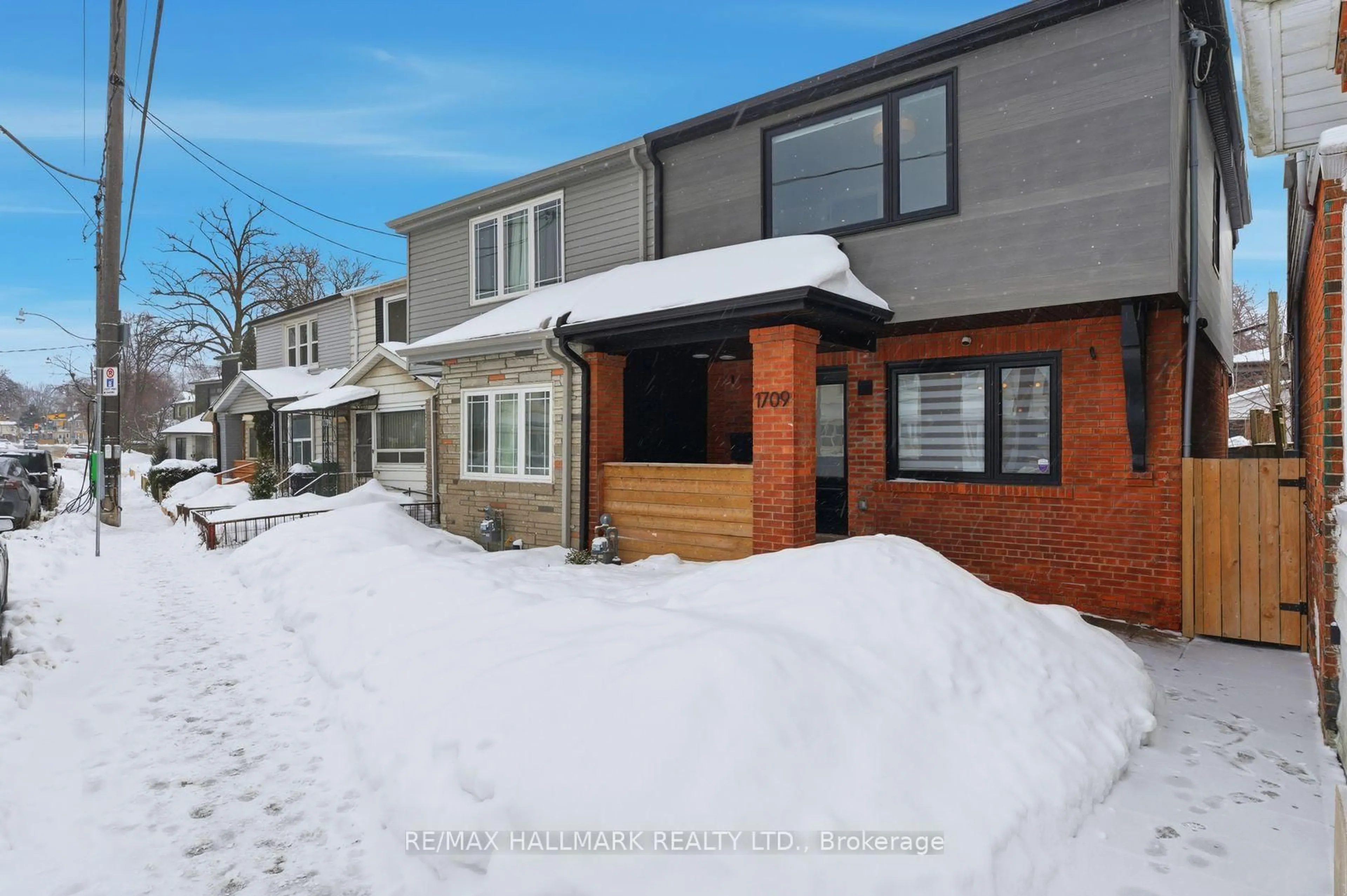 Home with brick exterior material, street for 1709 Dundas St, Toronto Ontario M4L 1L7
