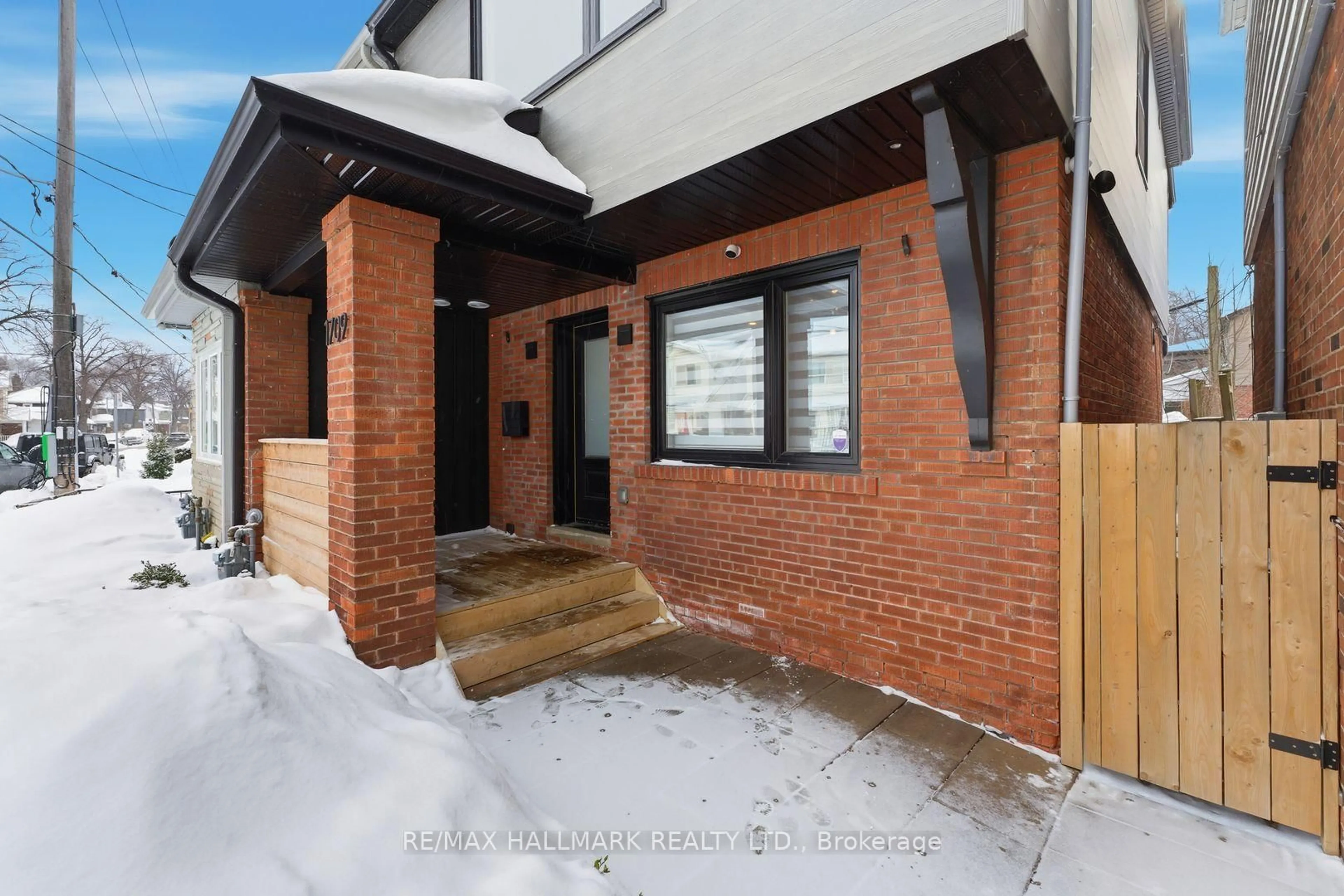 Home with brick exterior material, street for 1709 Dundas St, Toronto Ontario M4L 1L7