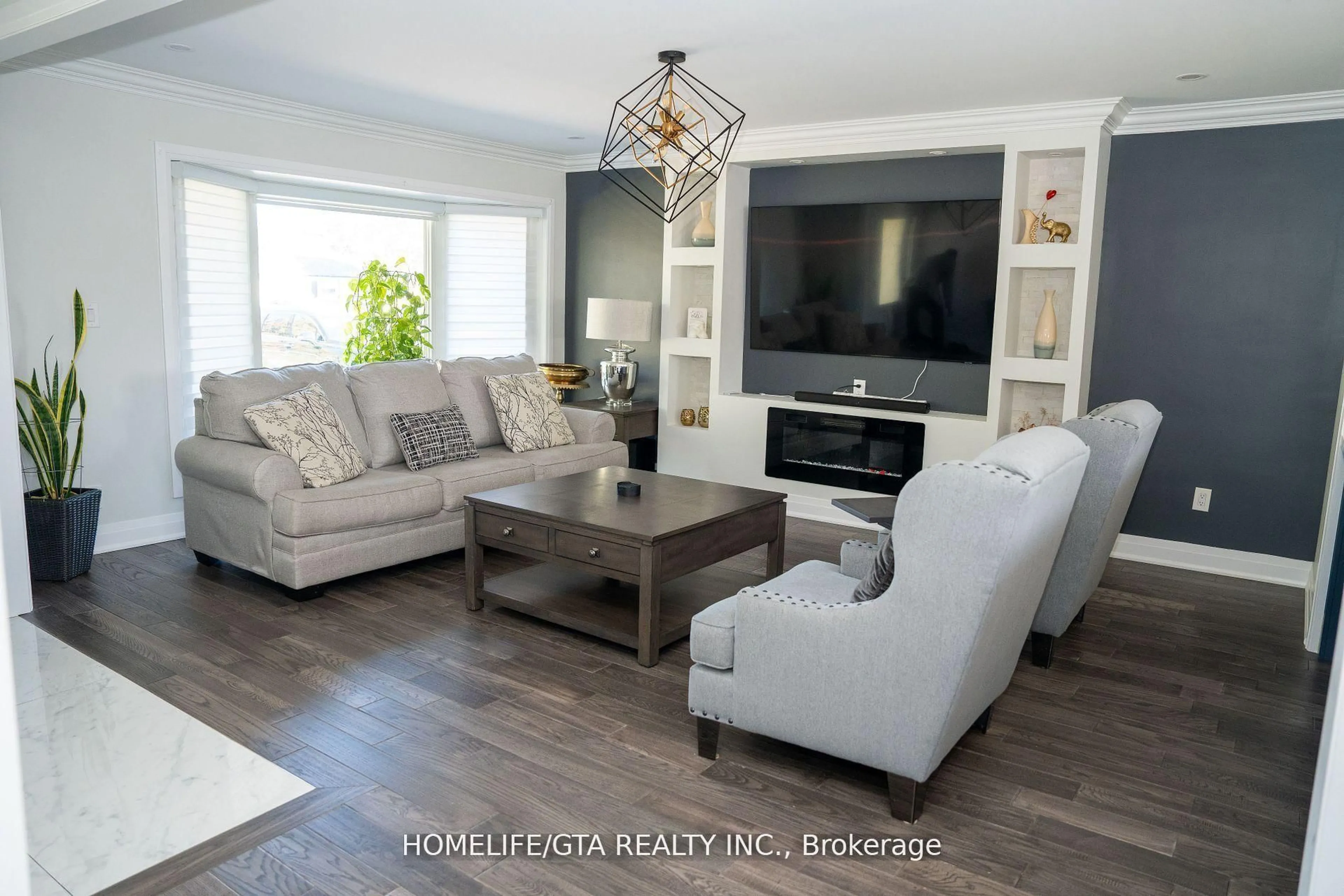 Living room with furniture, wood/laminate floor for 439 Rossland Rd, Oshawa Ontario L1J 3G9