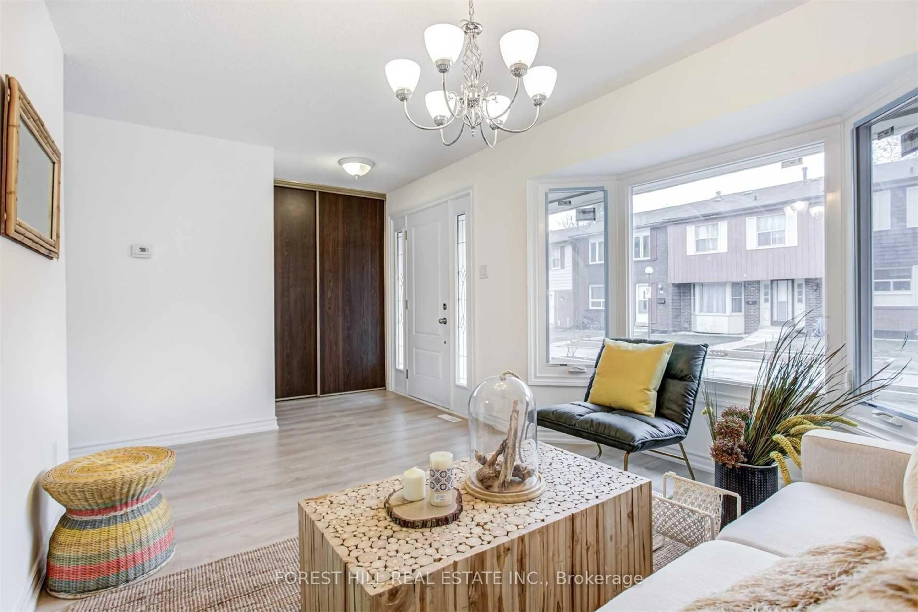 Living room with furniture, wood/laminate floor for 20 Brimwood Blvd #75, Toronto Ontario M1V 1B7