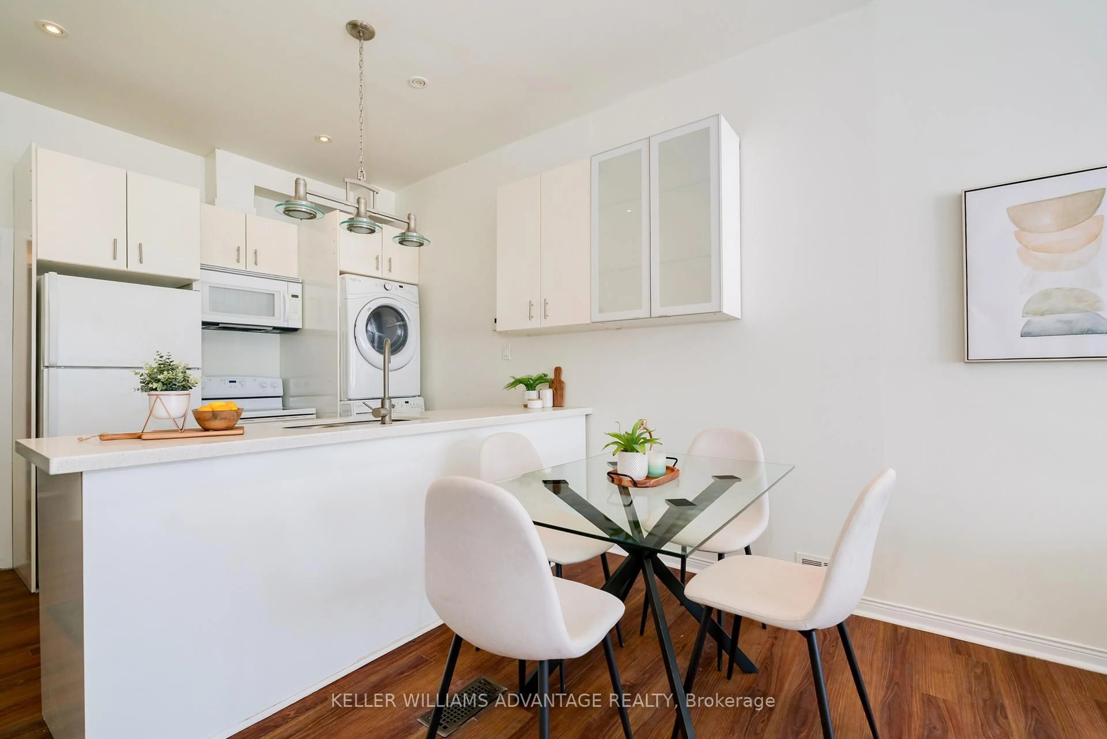 Open concept kitchen, wood/laminate floor for 493 Jones Ave, Toronto Ontario M4J 3G8