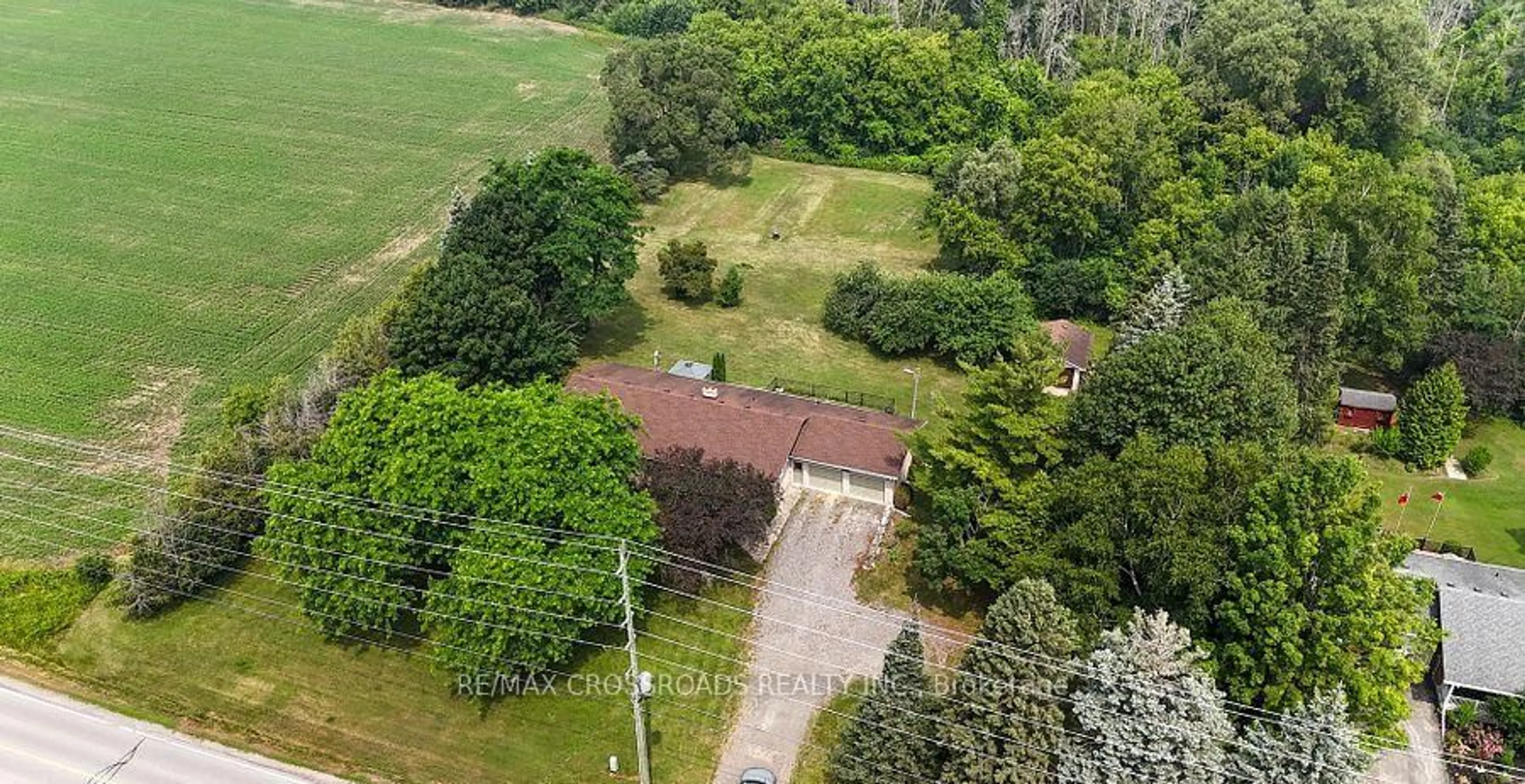 A pic from outside/outdoor area/front of a property/back of a property/a pic from drone, forest/trees view for 2292 Baseline Rd, Clarington Ontario L1C 0Y1