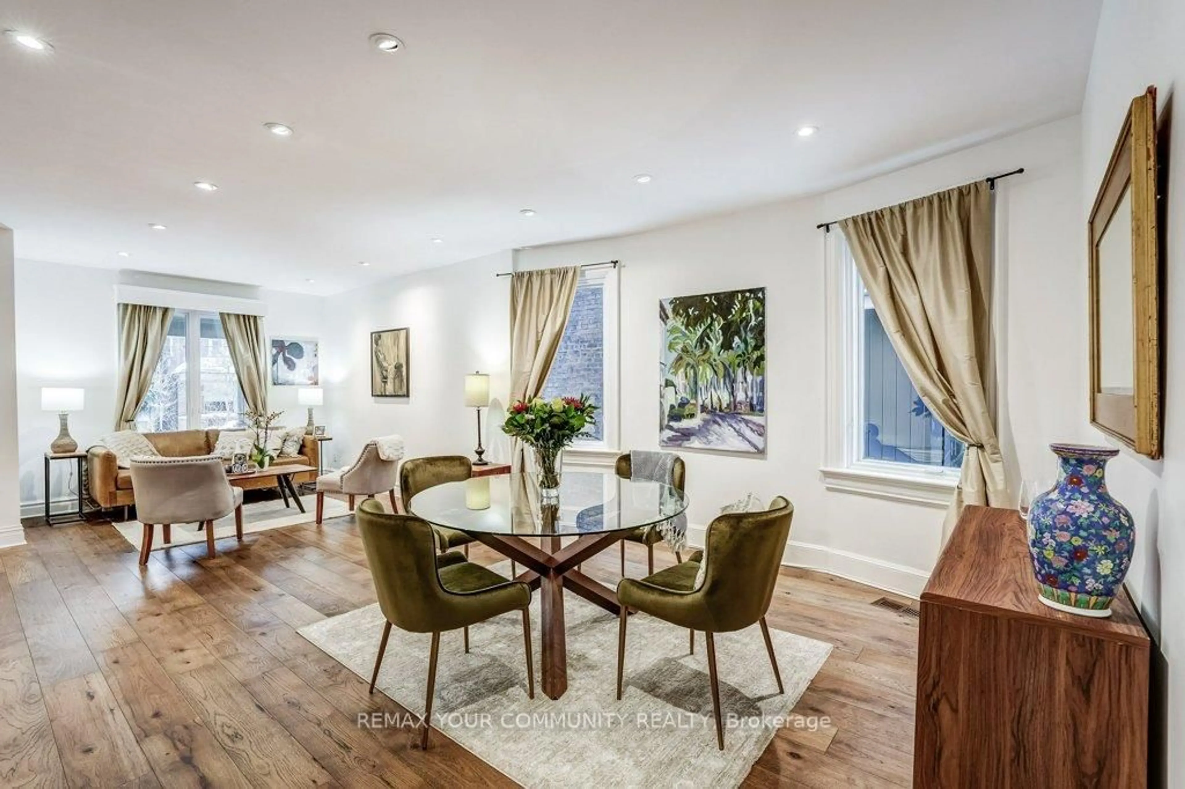 Dining room, wood/laminate floor for 11 1/2 Sparkhall Ave, Toronto Ontario M4K 1G4