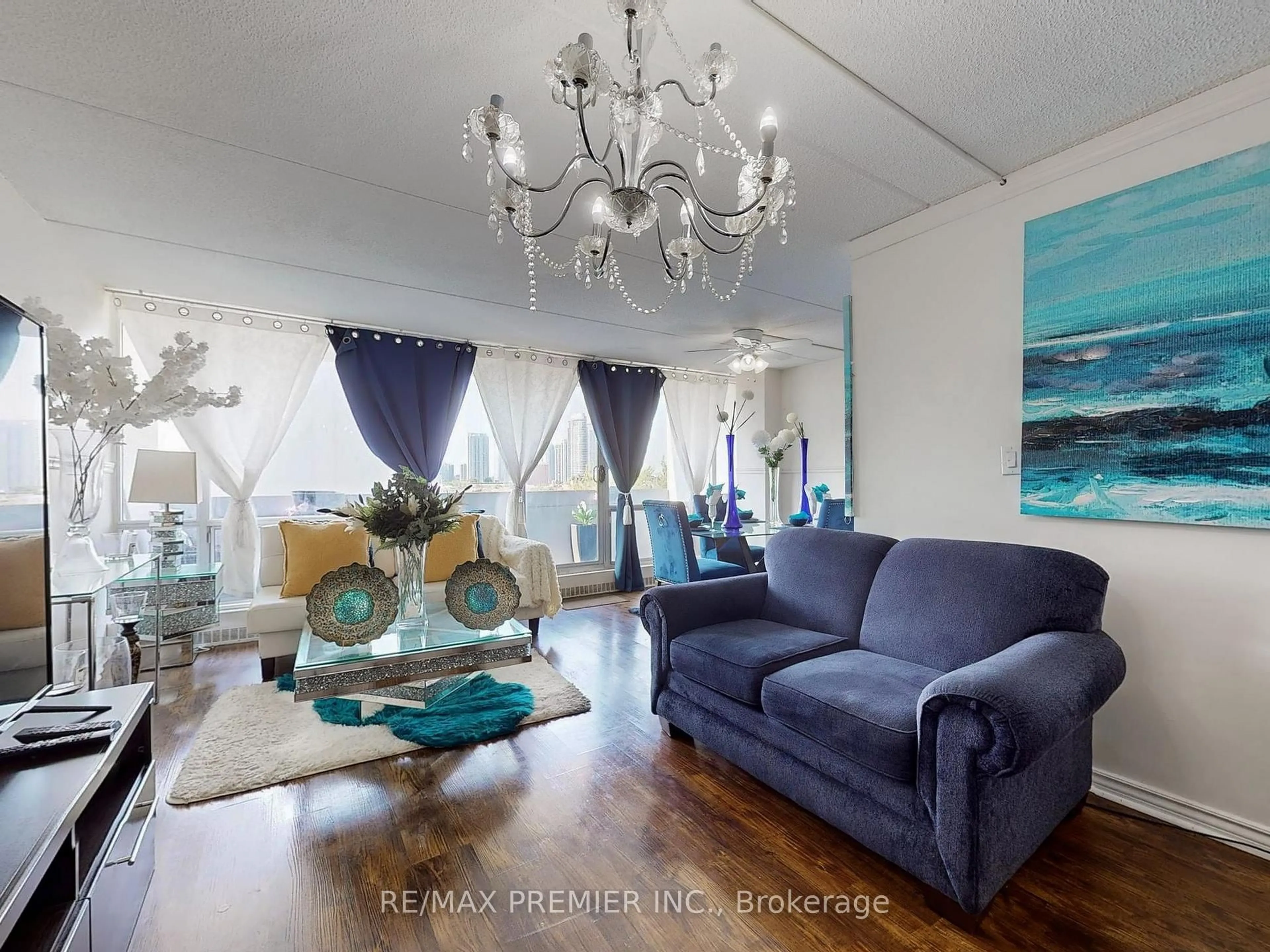 Living room with furniture, wood/laminate floor for 2 Glamorgan Ave #614, Toronto Ontario M1P 2M8