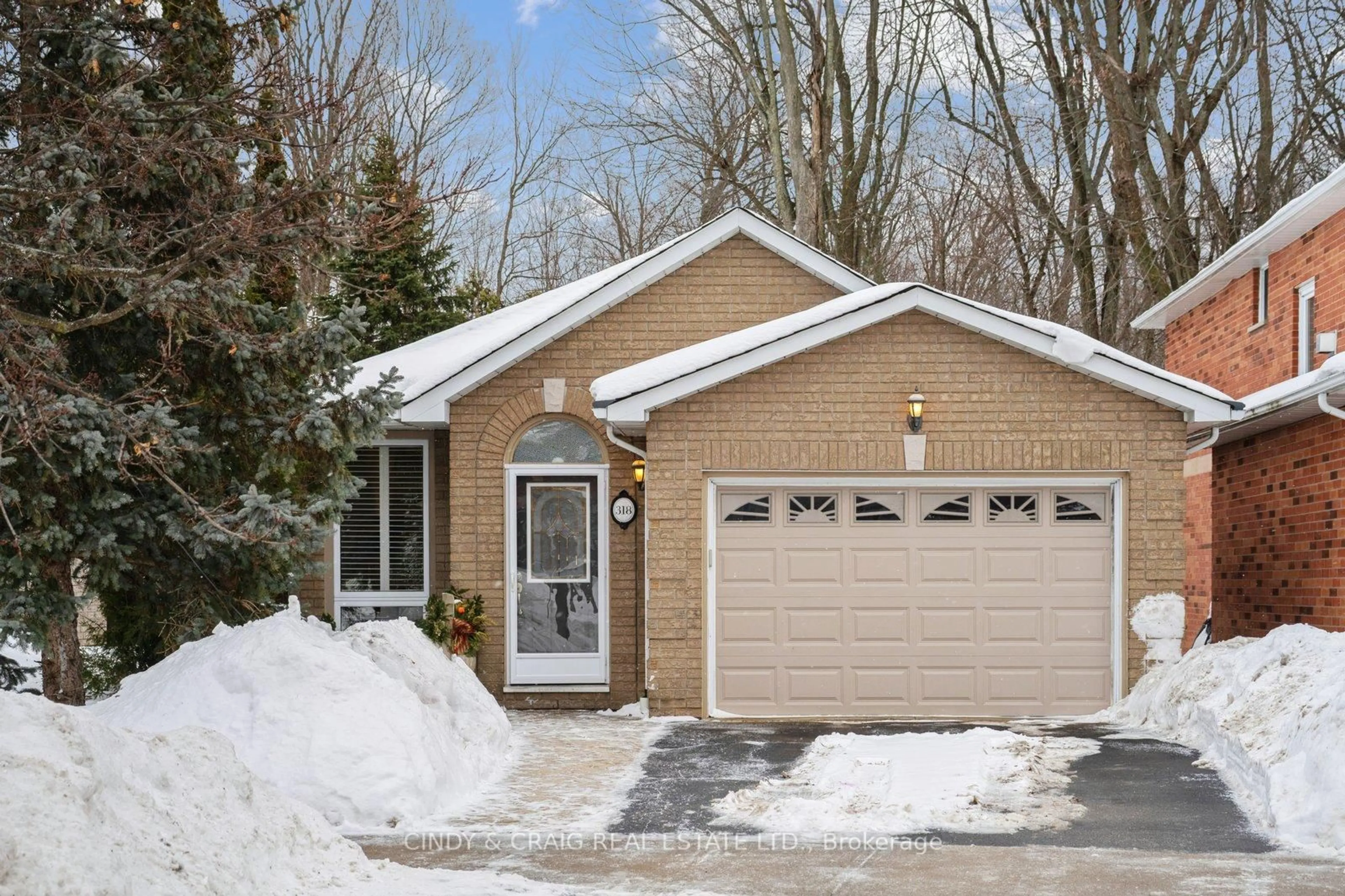 Home with brick exterior material, street for 318 Sandringham Dr, Clarington Ontario L1E 3A7