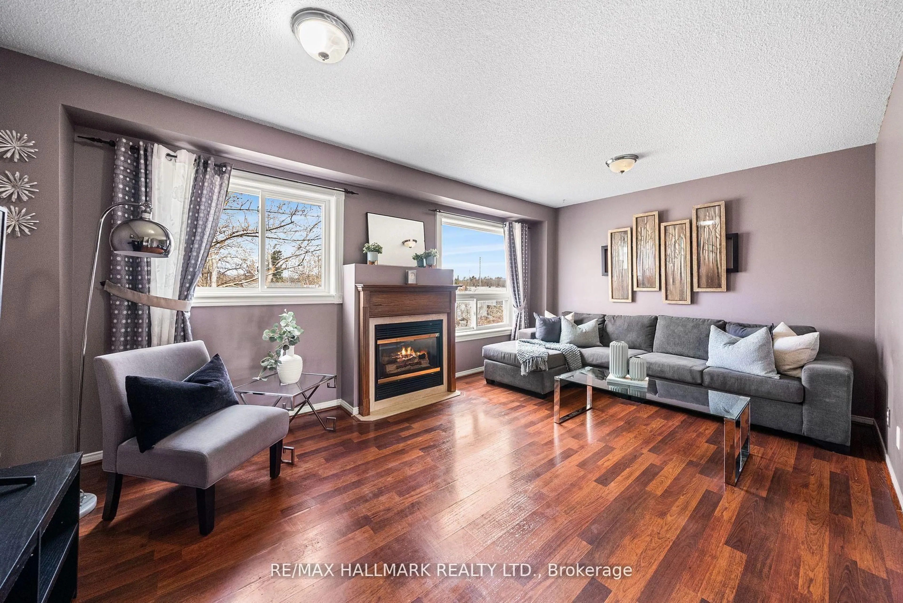 Living room with furniture, wood/laminate floor for 1867 Kingston Rd #18, Pickering Ontario L1V 1C9