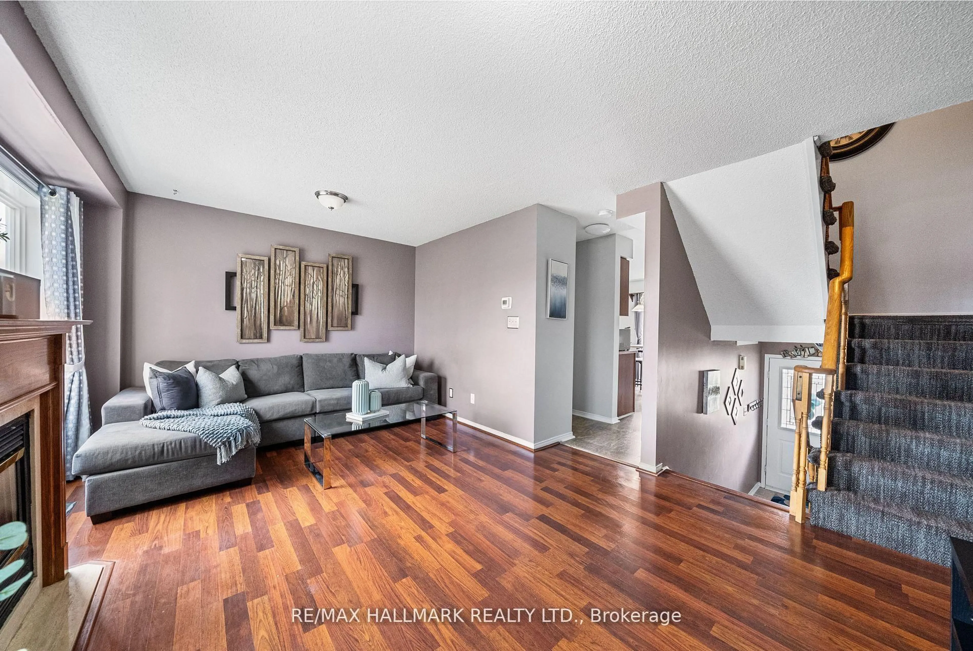 Living room with furniture, wood/laminate floor for 1867 Kingston Rd #18, Pickering Ontario L1V 1C9