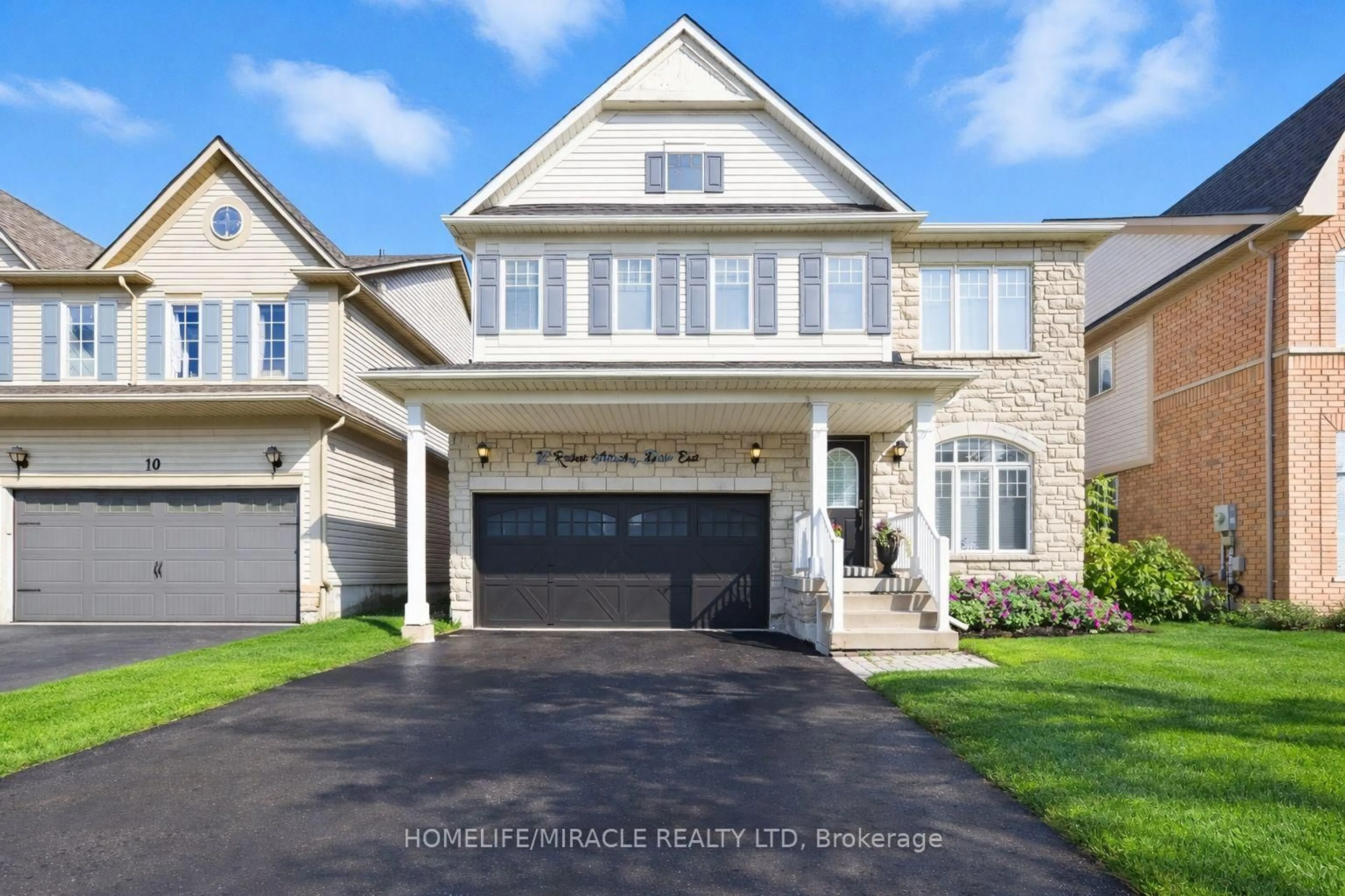 Home with brick exterior material, street for 12 Robert Attersley Dr, Whitby Ontario L1R 3E3