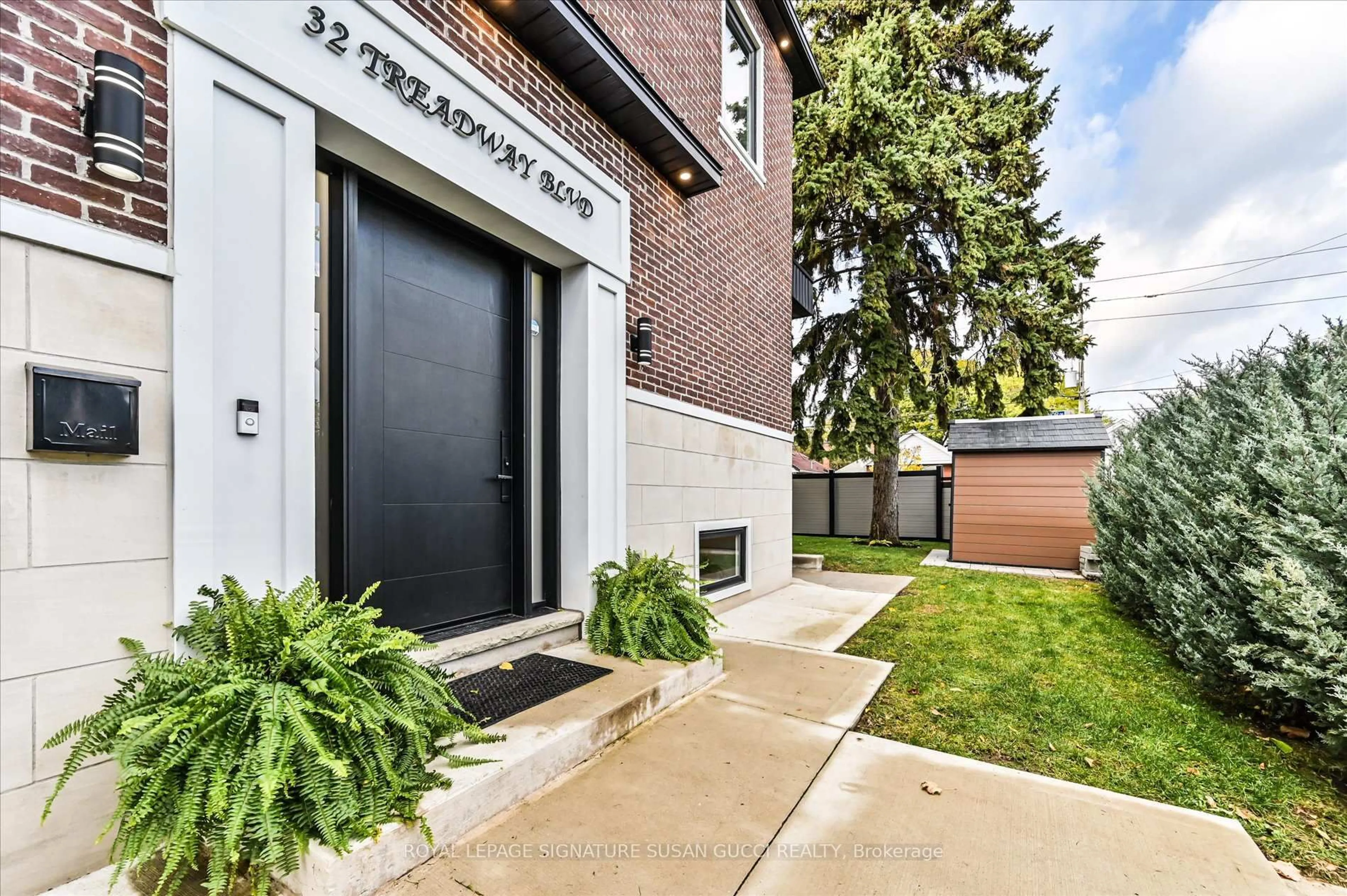 Home with brick exterior material, street for 32 Treadway Blvd, Toronto Ontario M4C 2Z7