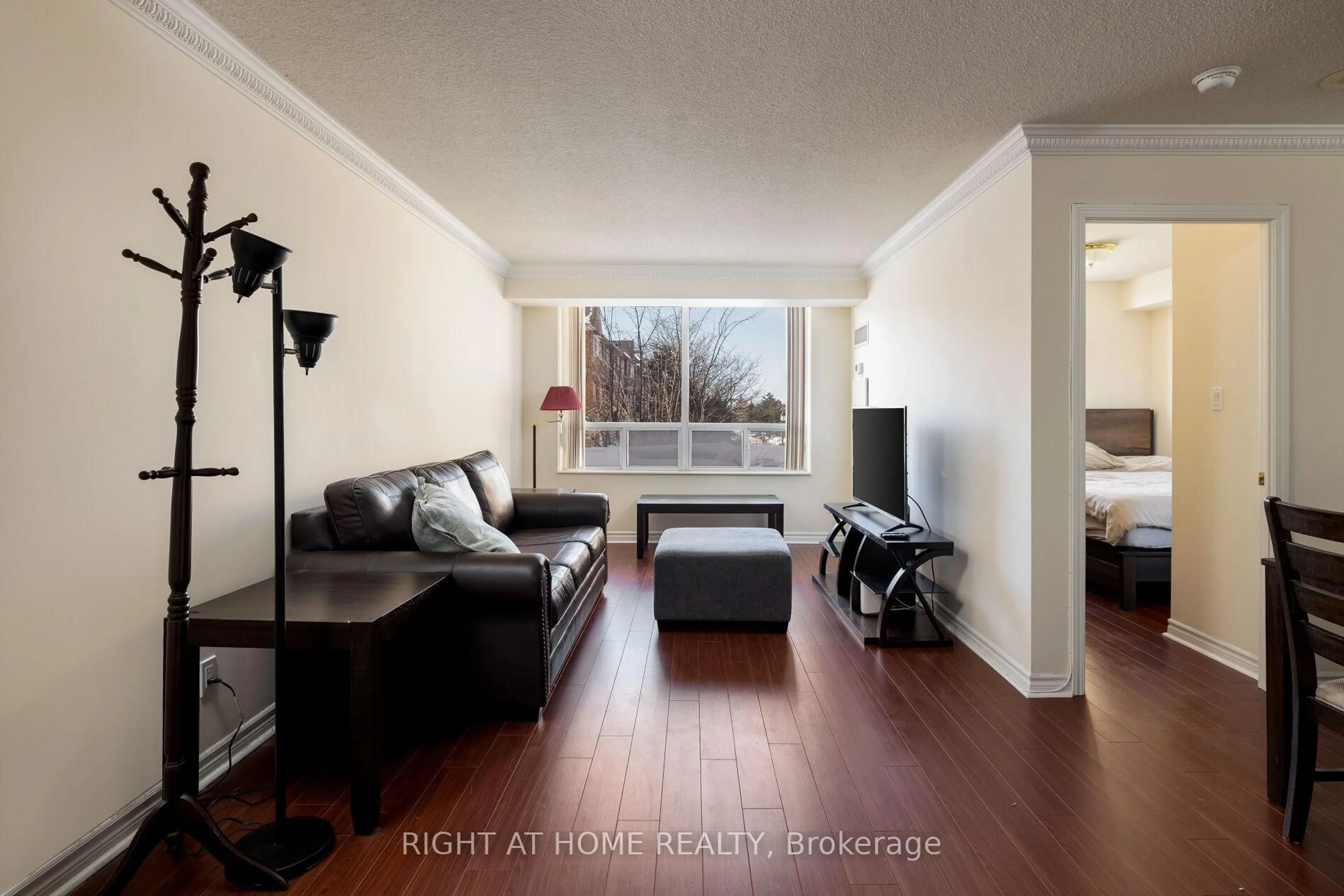 Living room with furniture, wood/laminate floor for 1883 Mcnicoll Ave #227, Toronto Ontario M1V 5M3