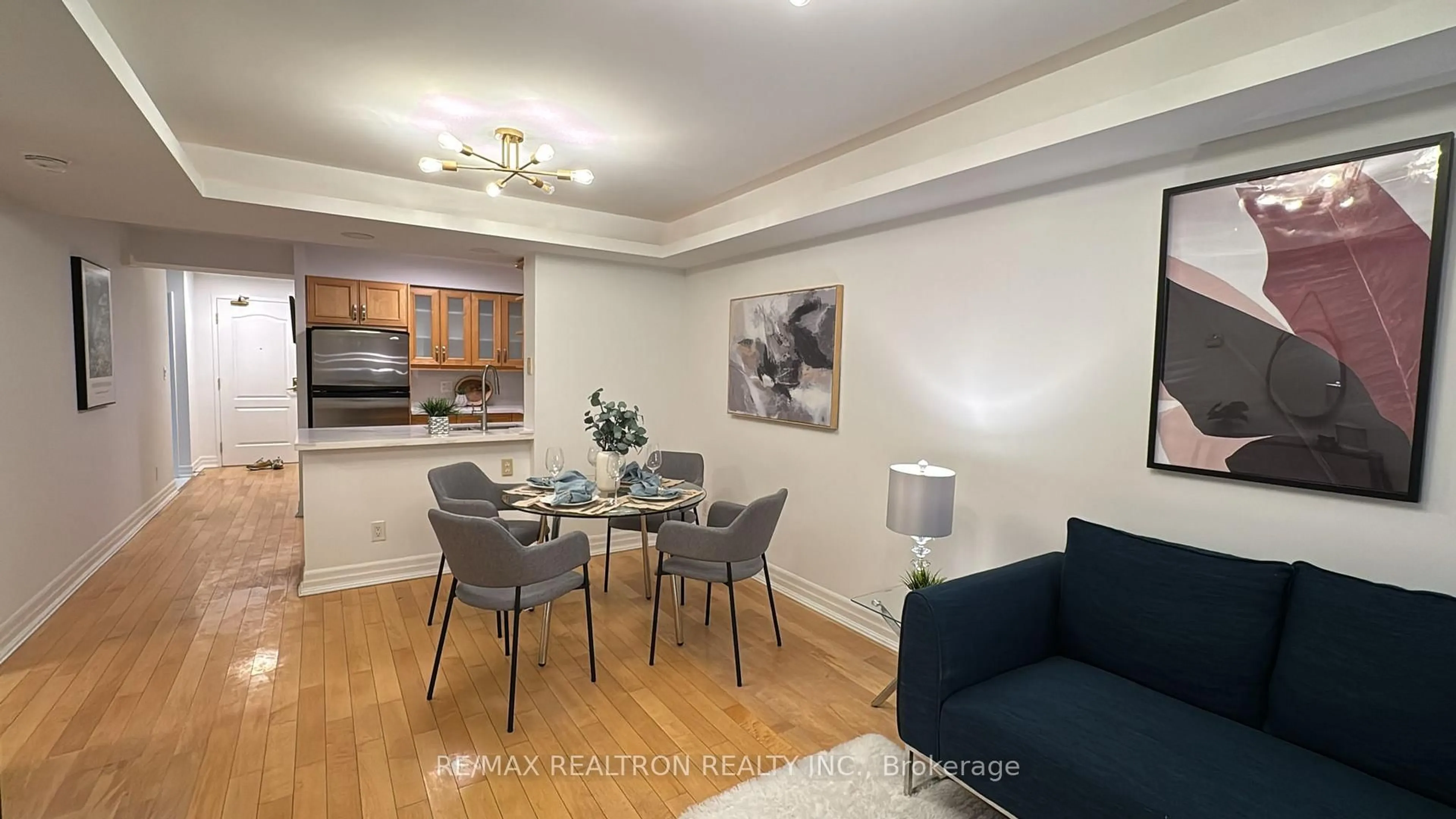 Living room with furniture, wood/laminate floor for 2020 McNicoll Ave #611, Toronto Ontario M1V 0B5