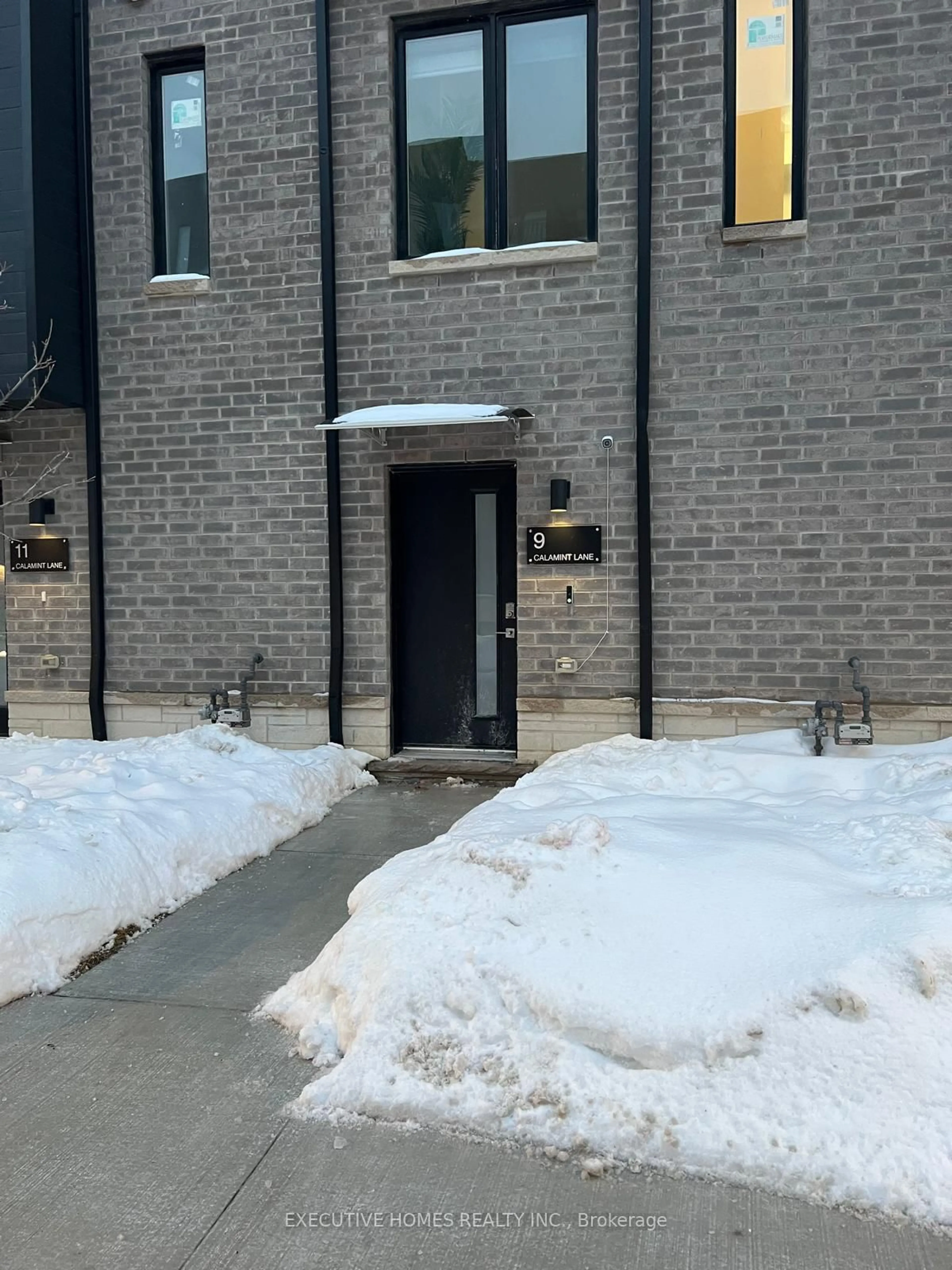 Home with brick exterior material, street for 9 Calamint Lane, Toronto Ontario M1W 2H1