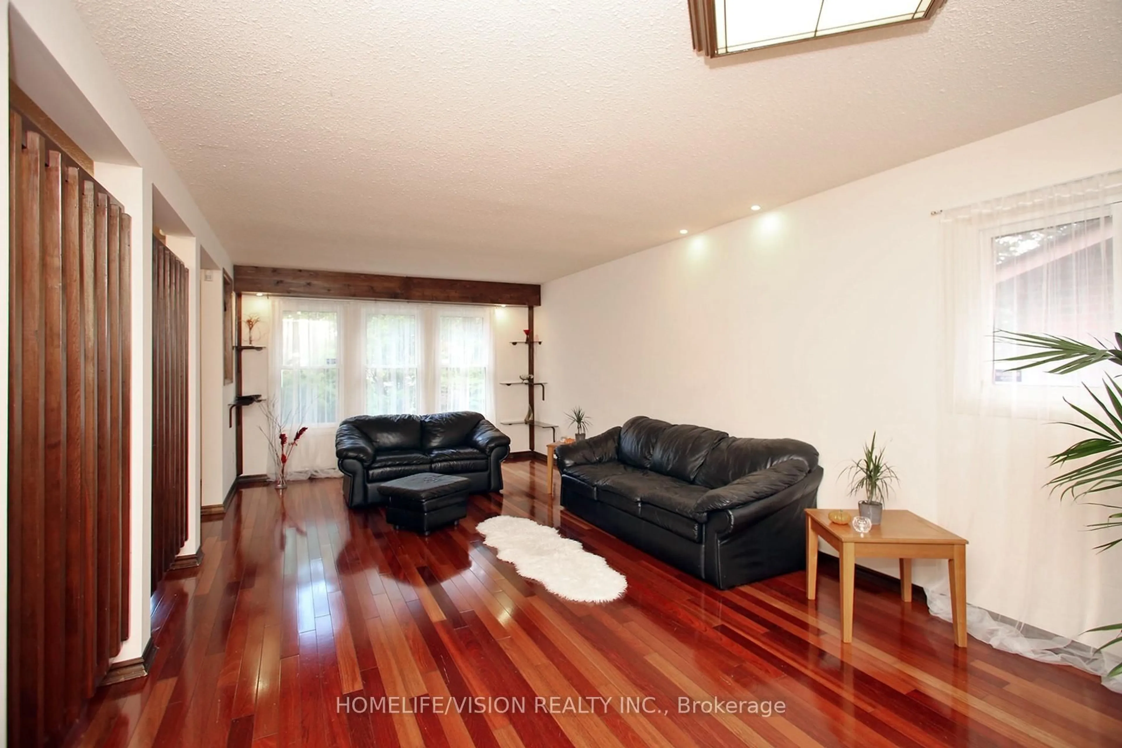 Living room with furniture, wood/laminate floor for 12 Relroy Crt, Toronto Ontario M1W 2Y7